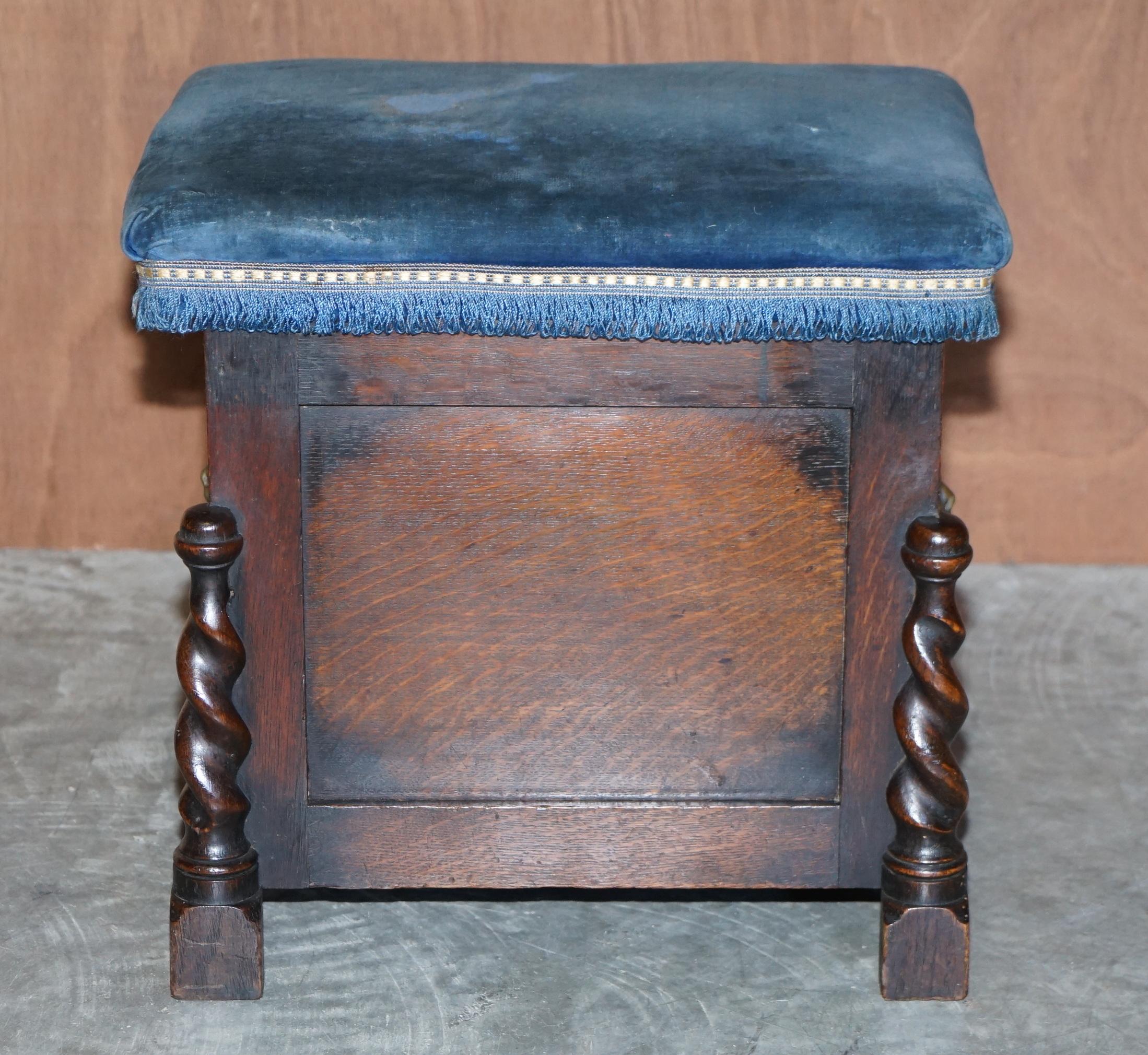 We are delighted to offer for sale this nice antique hand made in England oak footstool with Lions head handles and Regency Blue velvet top

A very well made and decorative piece, it looks smart and elegant in any setting, the fabric is Royal