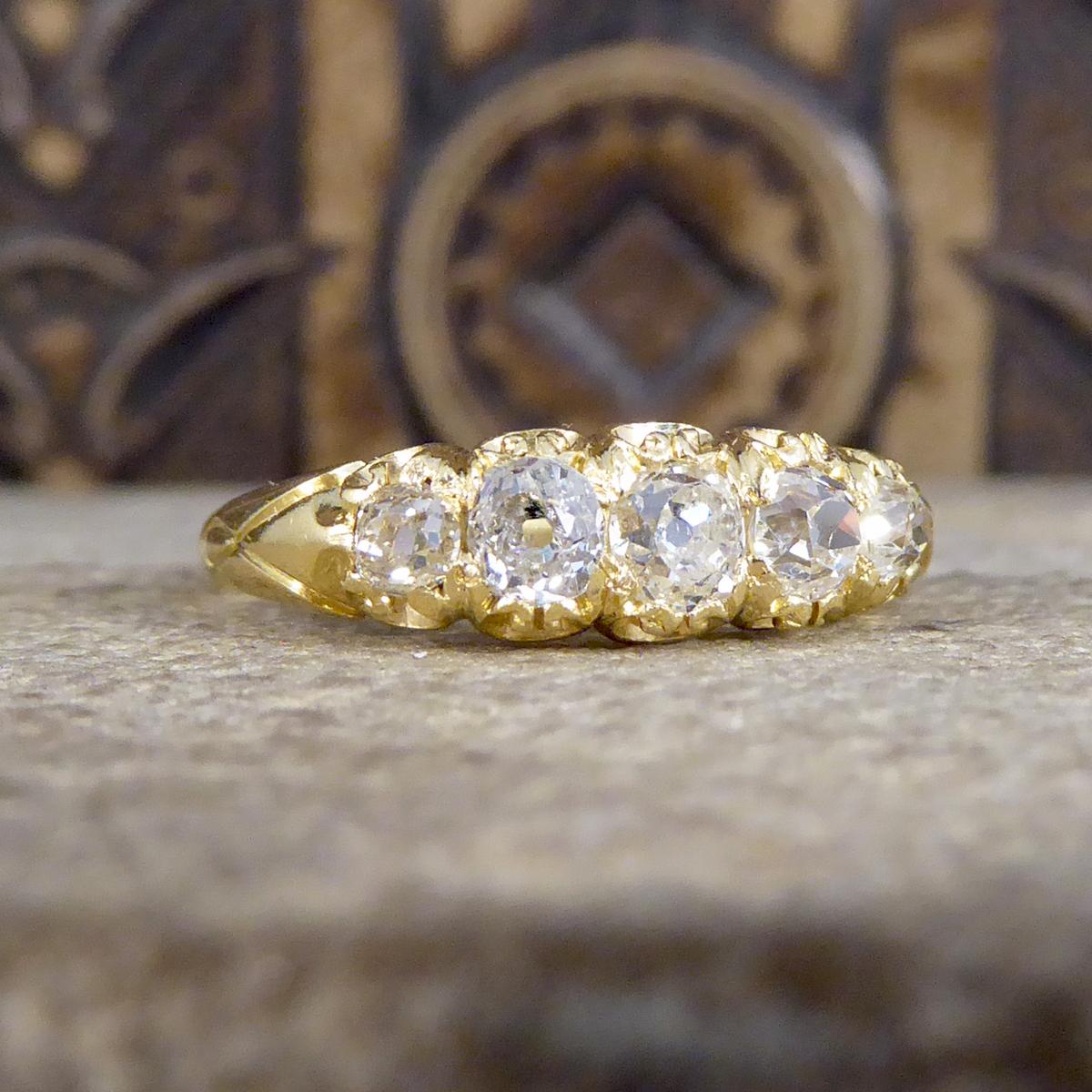 This gorgeous ring features five old cushion cut Diamonds on a wonderfully detailed gallery design. It has been hand crafted in 18ct yellow gold, it was crafted in the Late Victorian era and looks stately on the hand!

Diamond Details:
Cut: Old