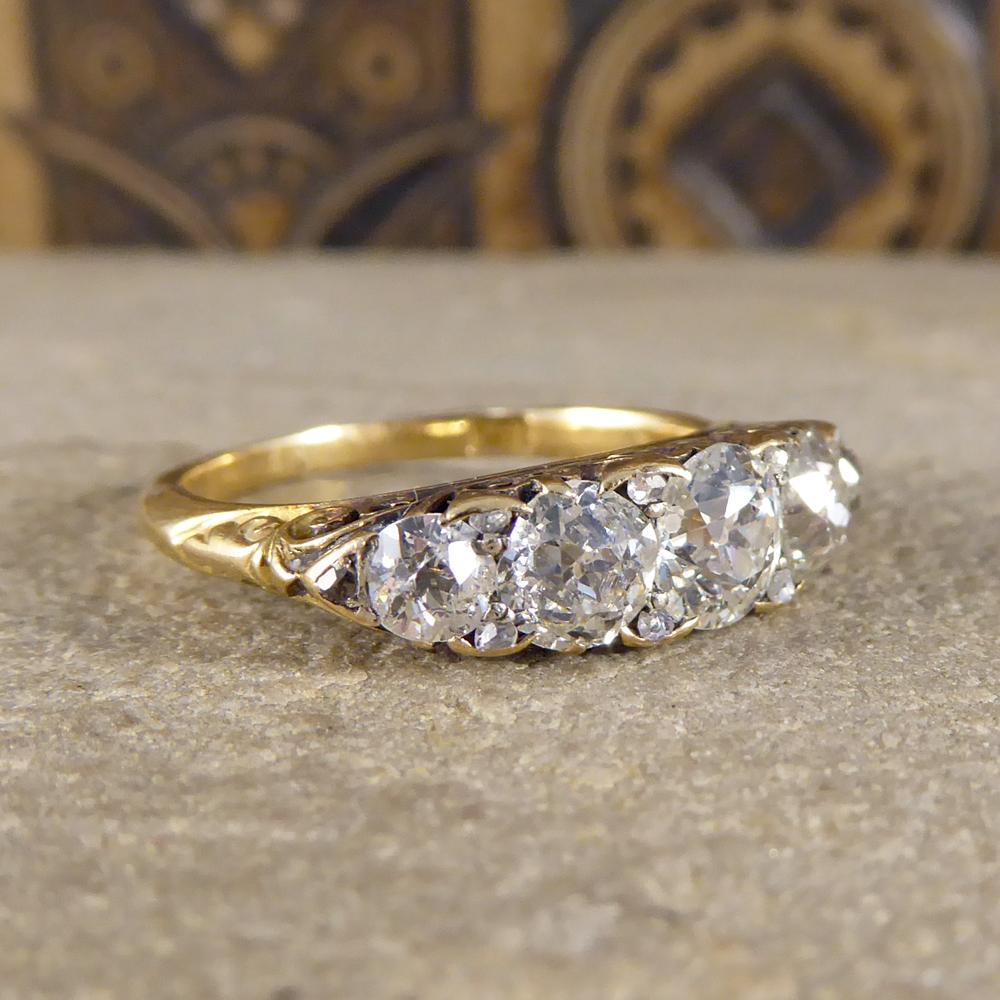 This classic antique five stone ring has been hand crafted in the Late Victorian era in 18ct Yellow Gold. The gallery one this ring is astonishing and highlights the quality of the craftsmanship in this era. With five Old Cut Diamonds weighing a