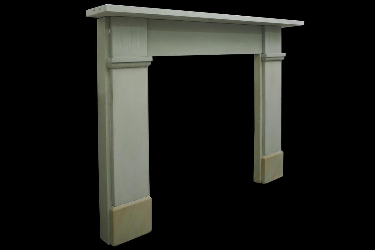 Reclaimed original Victorian mixed stone fireplace surround of simple form, with fluted capitals, circa 1880.