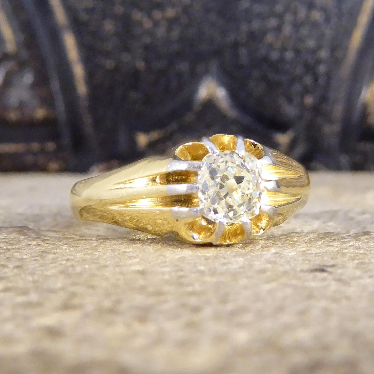 This flush set ring can be worn by men and women alike. Crafted in the Victorian era it was made out of 18ct Yellow Gold with Platinum tips holding the Diamond into place. Centred with a slightly tinted yet bright and clear Old Cushion Cut Diamond