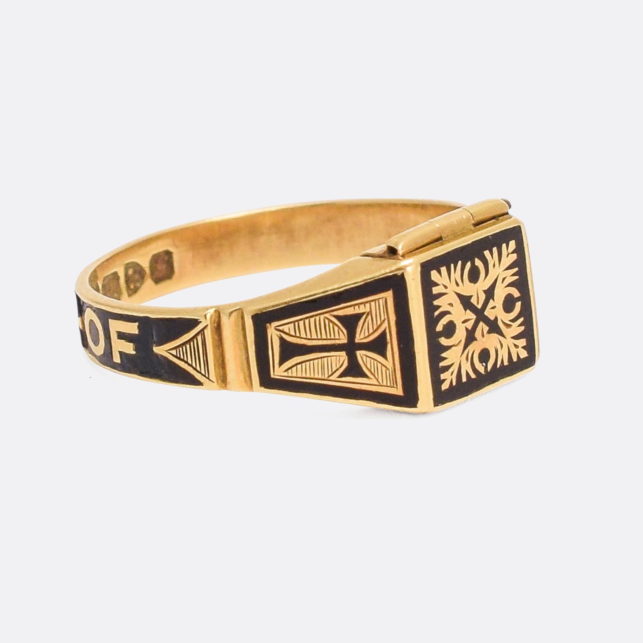 A superb antique memorial ring dating from the late 19th Century. It’s finished in intricate black enamel work, including cross motifs and the words In Memory Of around the back of the band. The face is hinged, opening to reveal a square locket