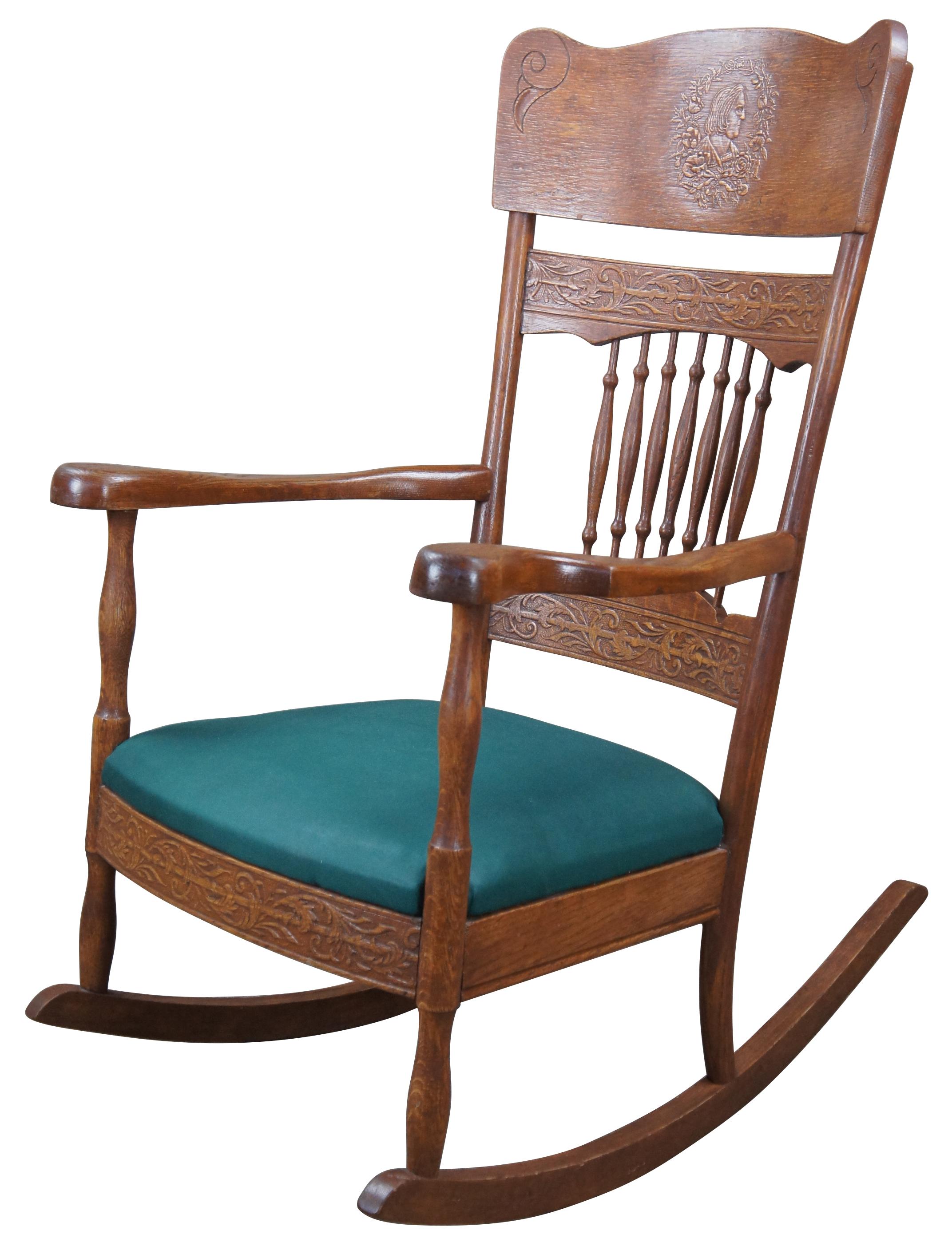 Antique late Victorian pressback rocking chair.  A beautiful design featuring a serpentine crest rail with a laurel wreath wrapped cameo at the center featuring a distinguished gentleman.  The cameo is flanked by decorative engravings along the
