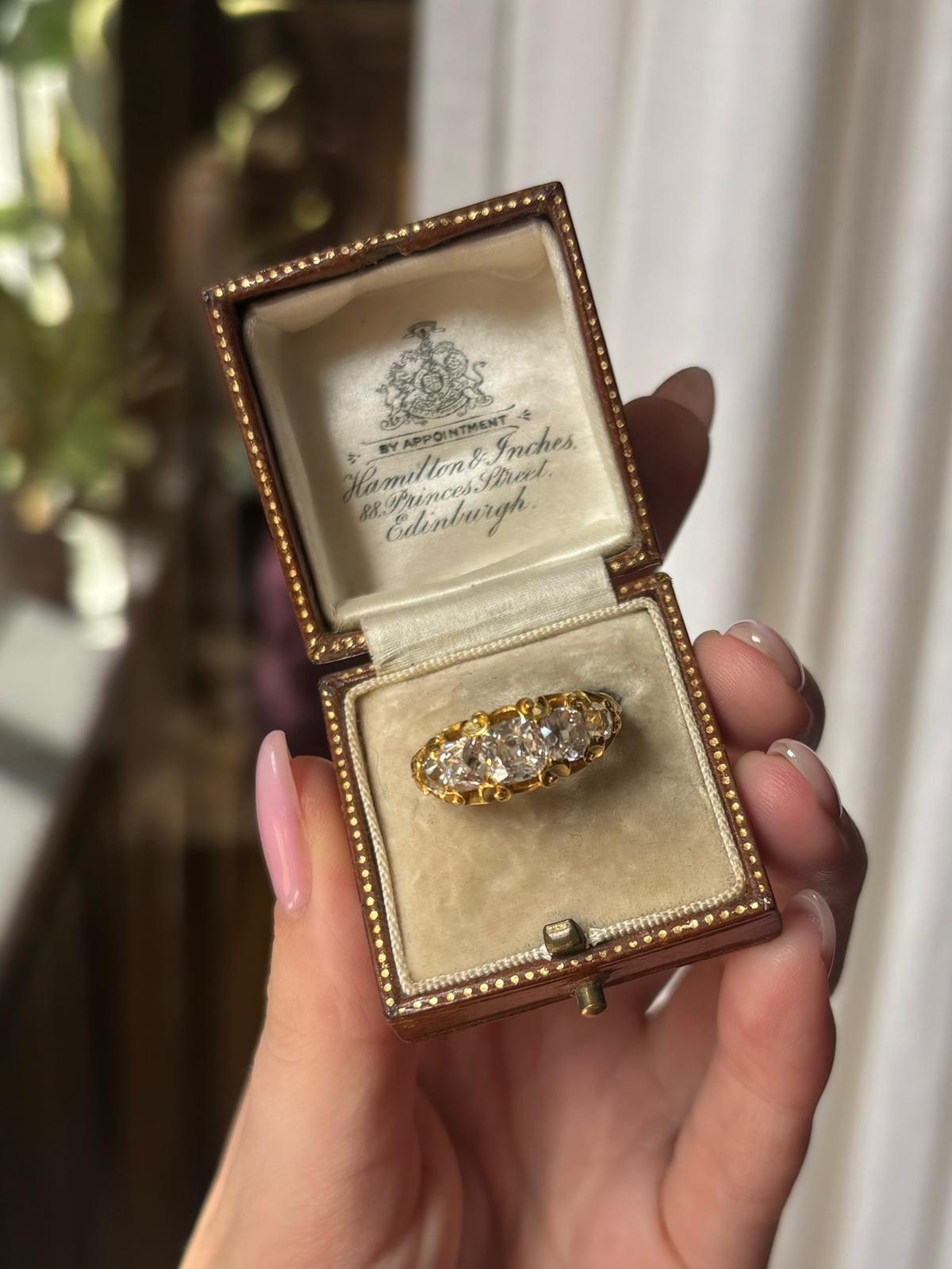 A beautiful antique late Victorian old cushion cut diamond five stone ring set in 18k yellow gold.

The ring is set with five sparkly old cushion cut diamonds, gradually graduating in size from the centre. Each diamond is intricately claw set