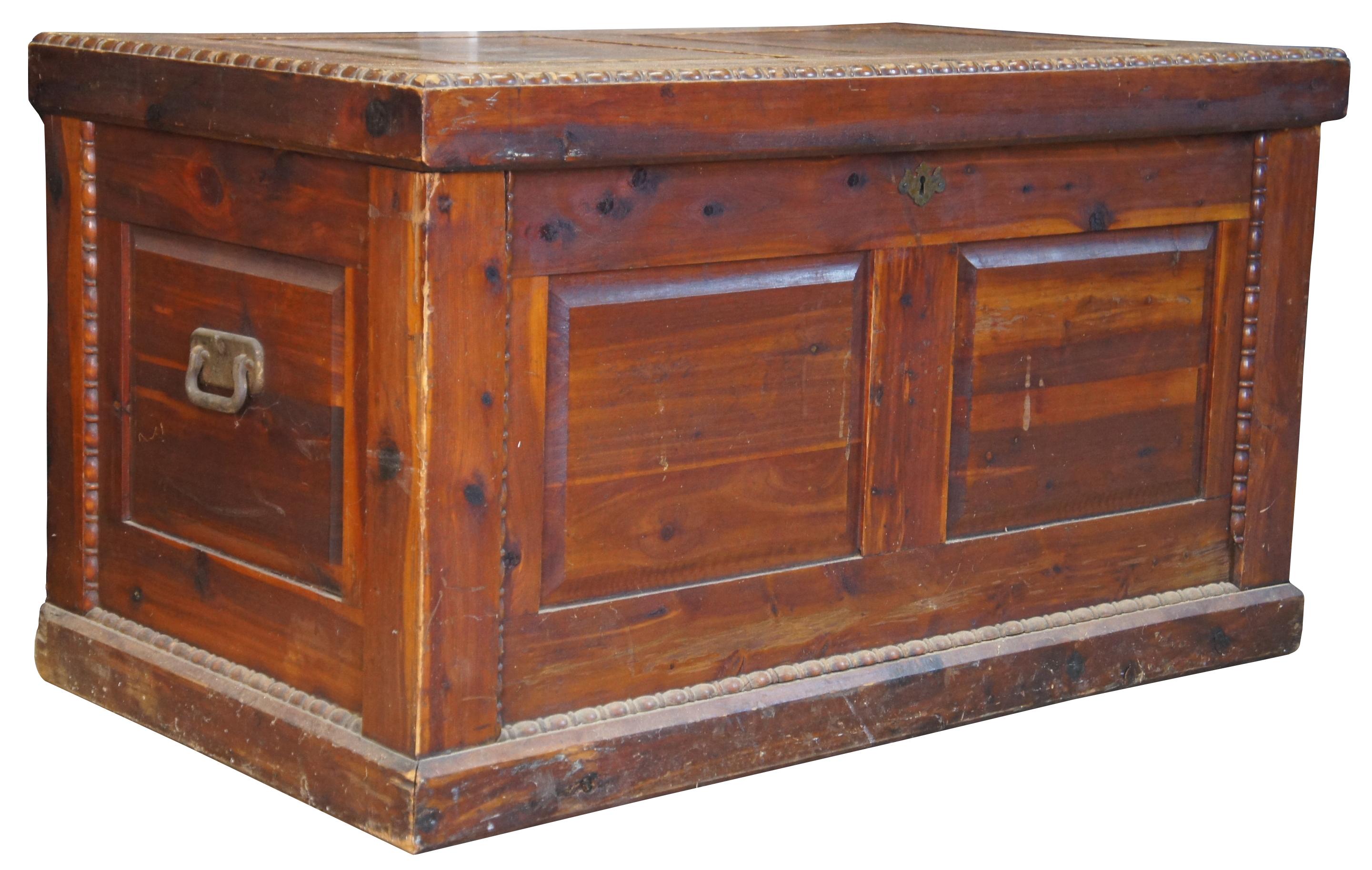 Early 20th century cedar chest. Feature a paneled case with ornately beaded trim and brass handles. Great for use to store blanket or as a table. Measure: 42