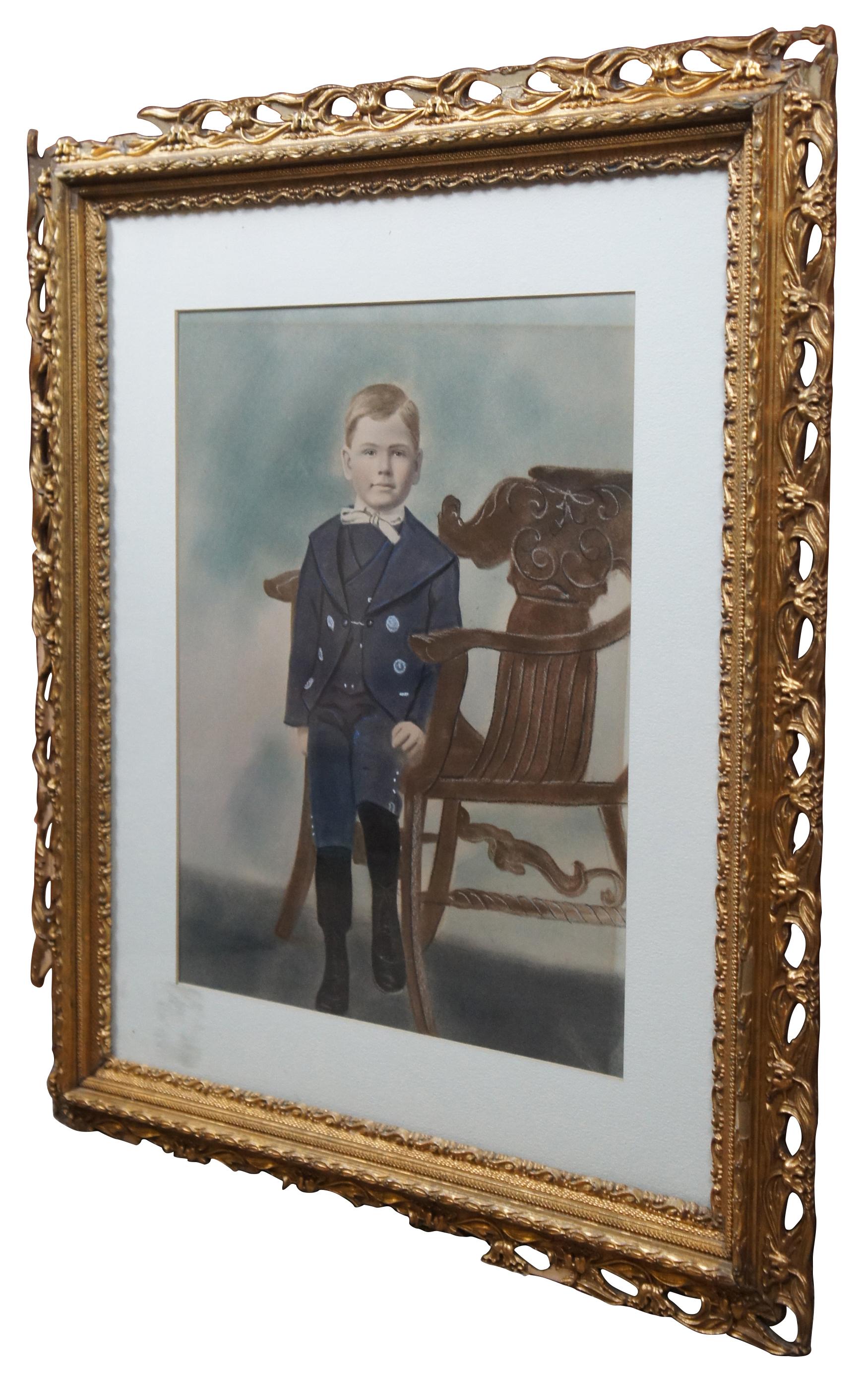 Antique pastel portrait of a young boy in early 20th century clothing sitting upon a Victorian Northwind chair. A sticker previously affixed to the front glass identified the boy as Marcel Goffena, possibly the same Marcel Goffena (1913-1999) who