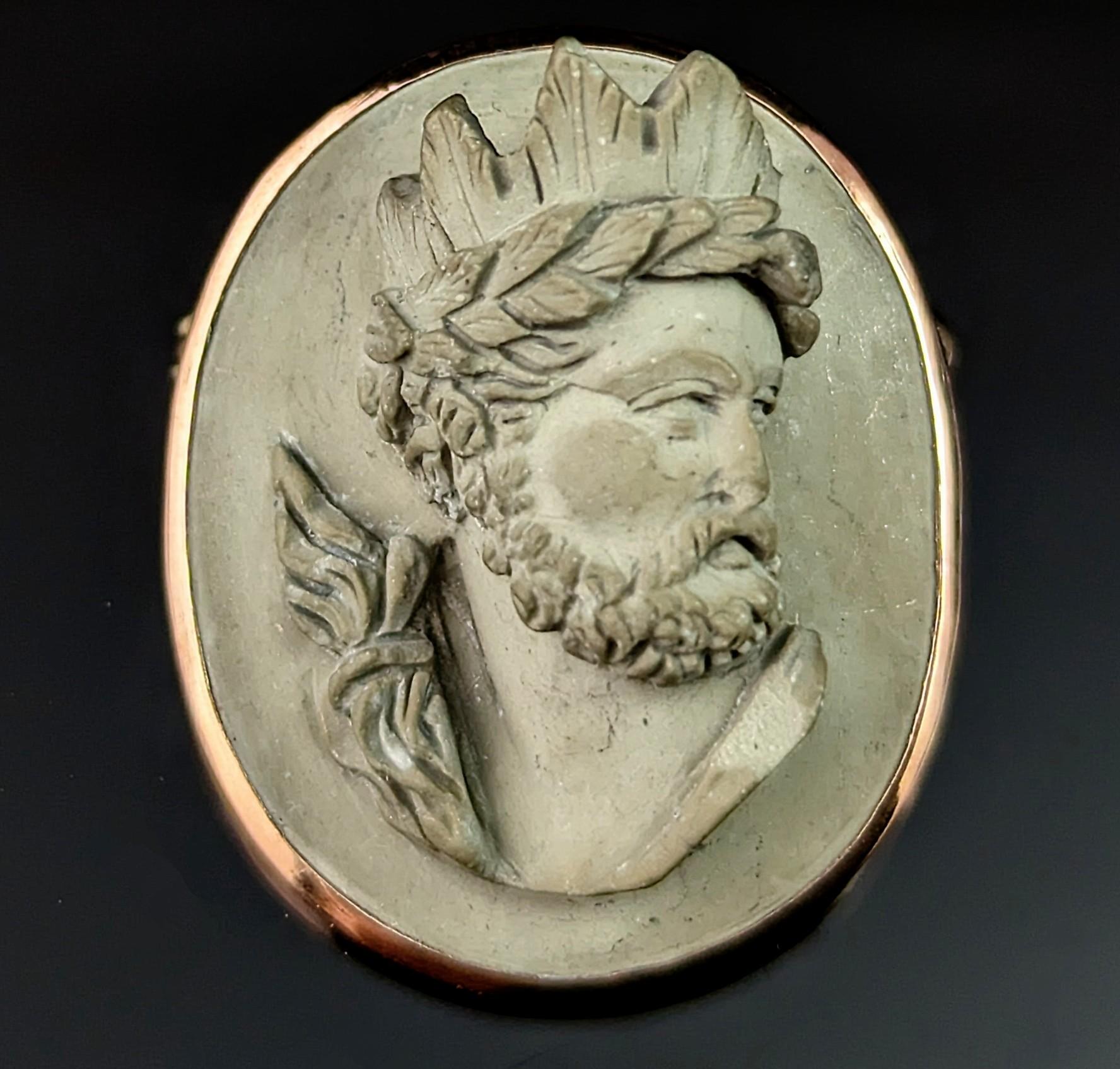 This beautiful antique, late 19th century Lava Cameo brooch is a little different and unique.

It is very finely carved as the bust of Helios, an unusual subject and not one I have seen on a lava cameo before.

Helios is the God and personification