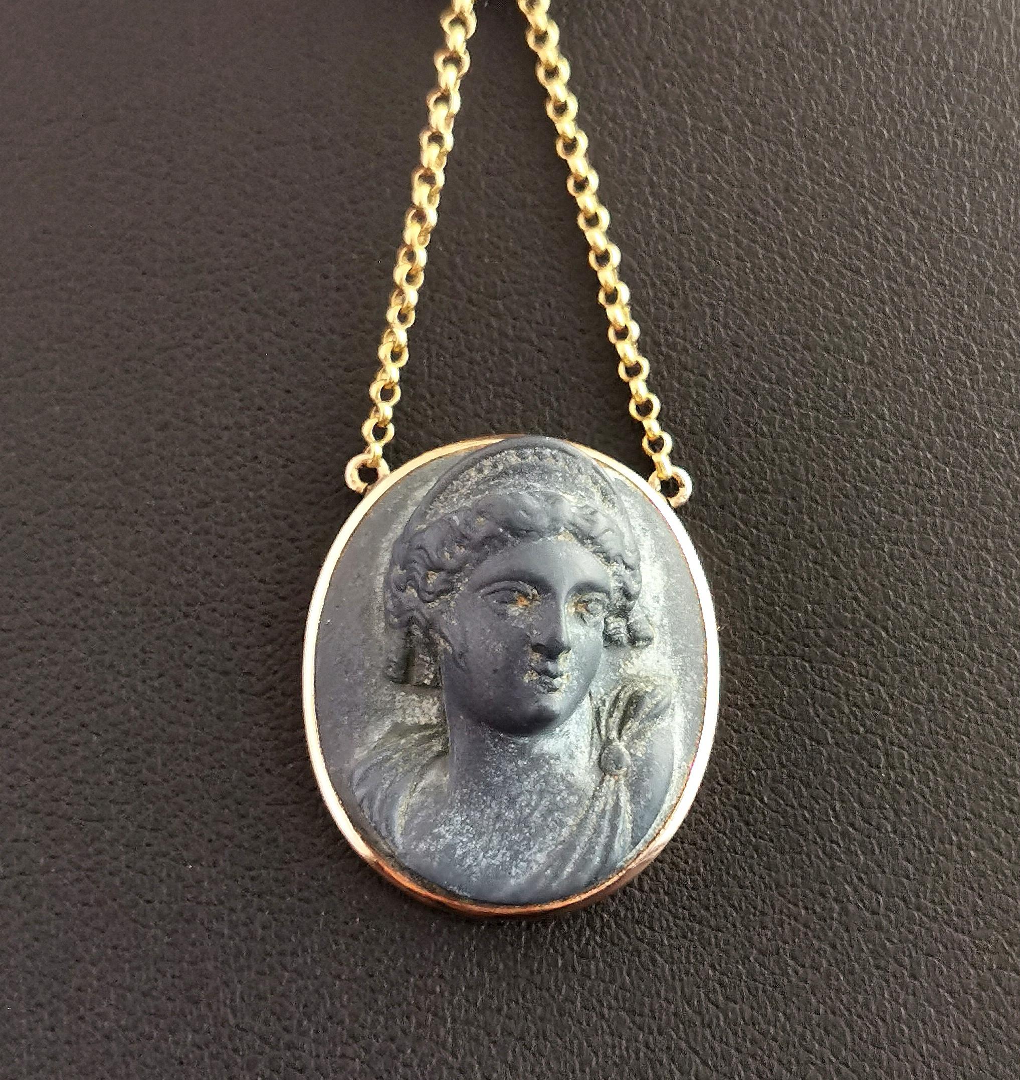 A beautiful antique, late 19th century Lava Cameo pendant.

It has a dark grey ashy tone, finely carved with the profile of a classical lady.

Lava Cameos and Lava stone jewellery rose to fashion in the Grand Tour era, early 19th century.

They