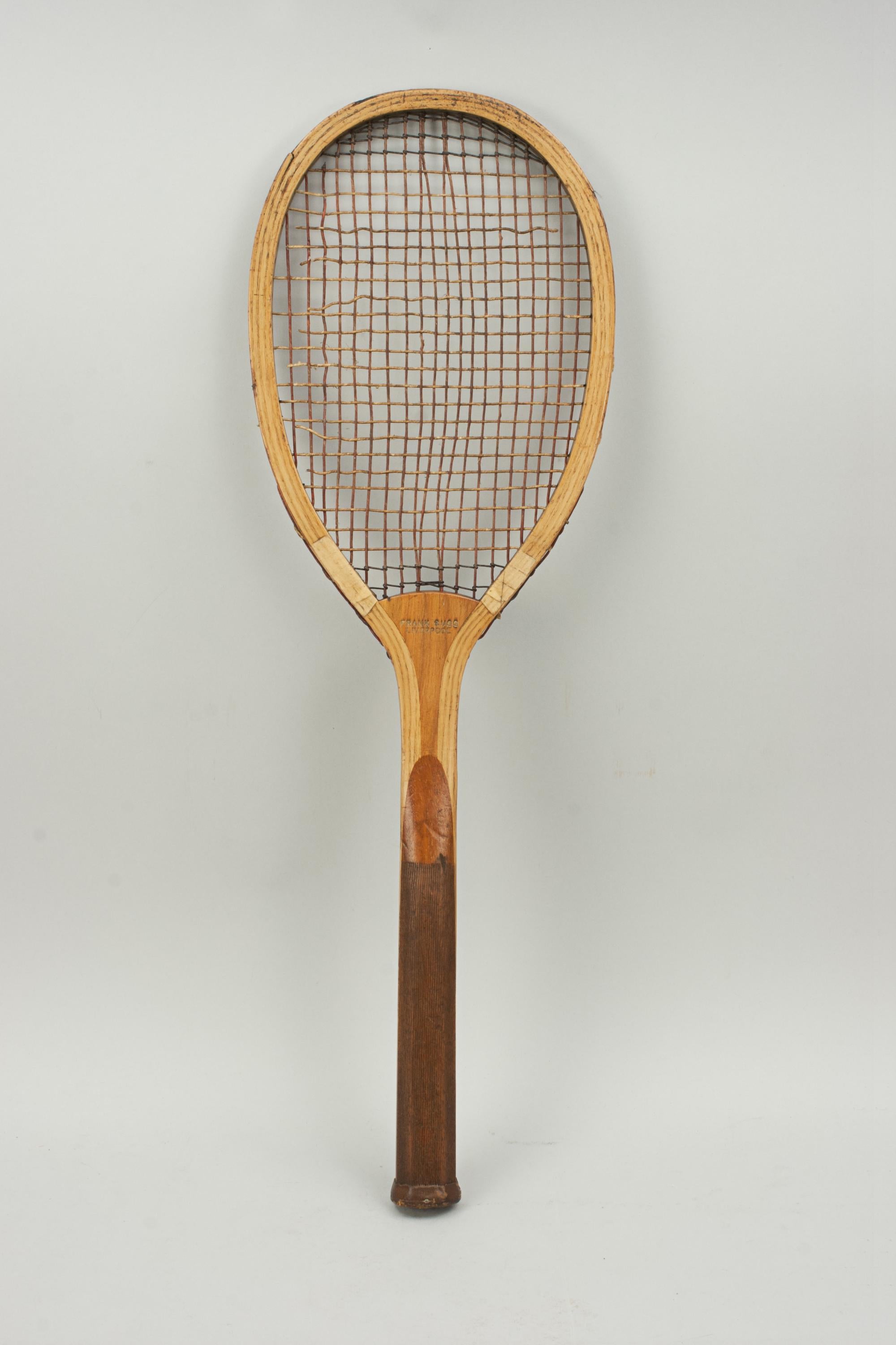 Wooden Lawn Tennis Racket, Frank Sugg, Liverpool.
A fine example of a wooden framed lawn tennis racket by Frank Sugg Ltd., Liverpool. A nice ash framed racket with convex wedge. The walnut wedge is embossed in gilt 'Frank Sugg, Liverpool' on one