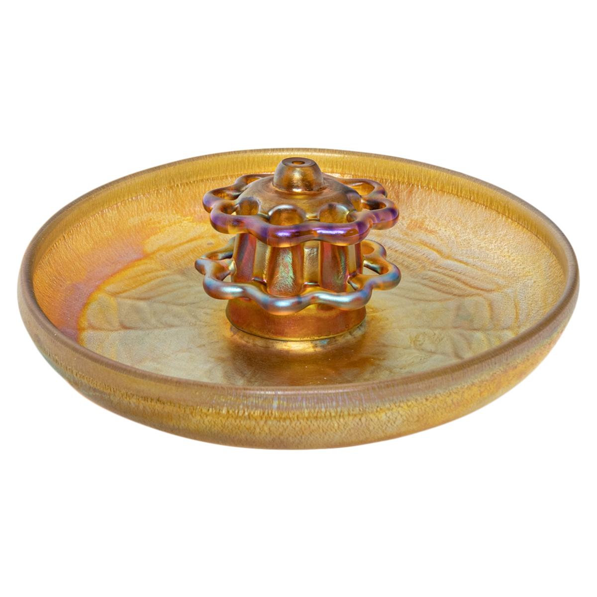 Antique Art Nouveau L.C. Tiffany Furnaces Favrille iridescent gold glass flower frog & bowl, 1920.
The bowl and flower frog are handblown in a gold iridescent glass, the two tier flower frog fits onto the shallow bowl that has a 'spider's web'