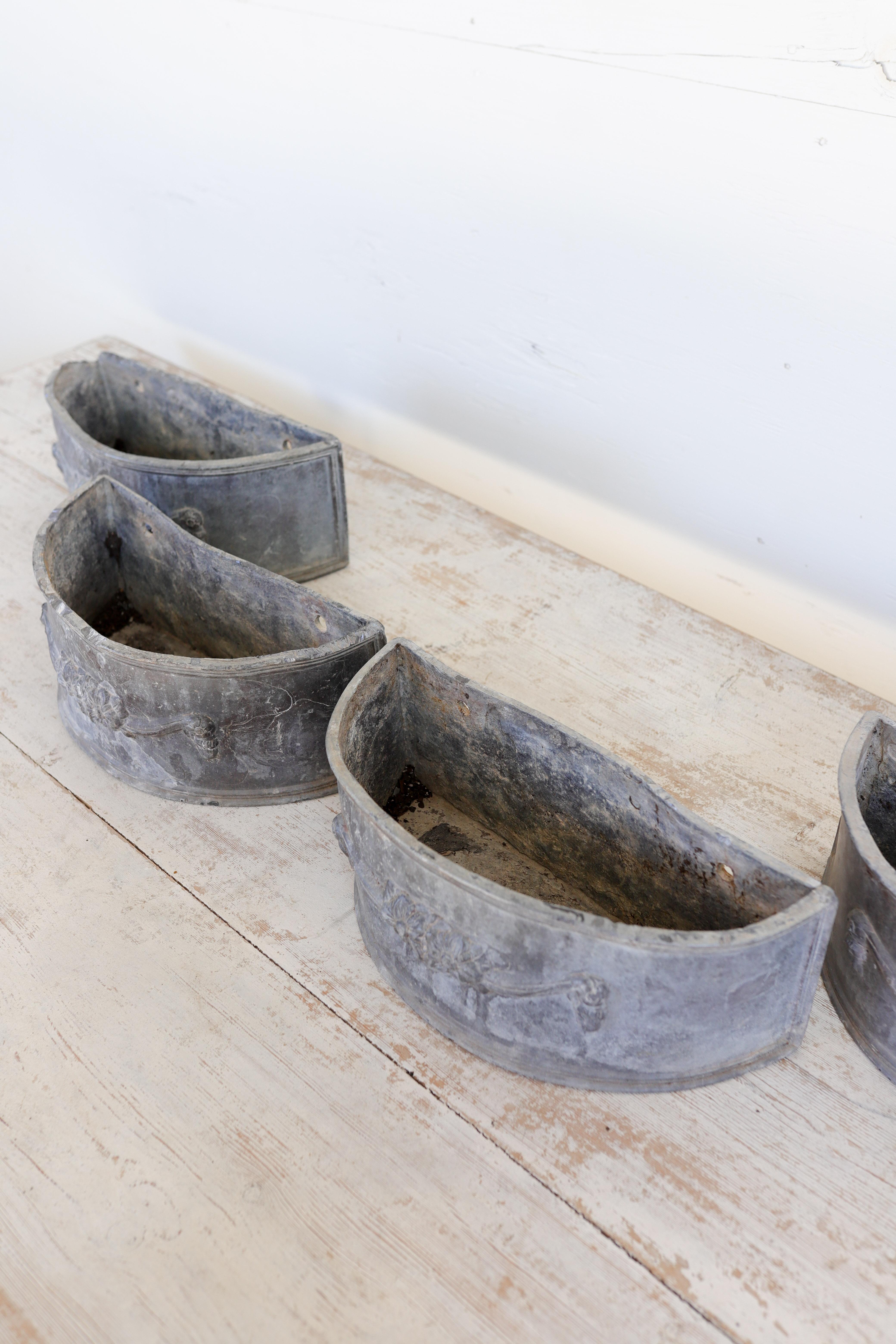 Hand-Carved Antique Lead Demilune Planters with Swag Decoration For Sale