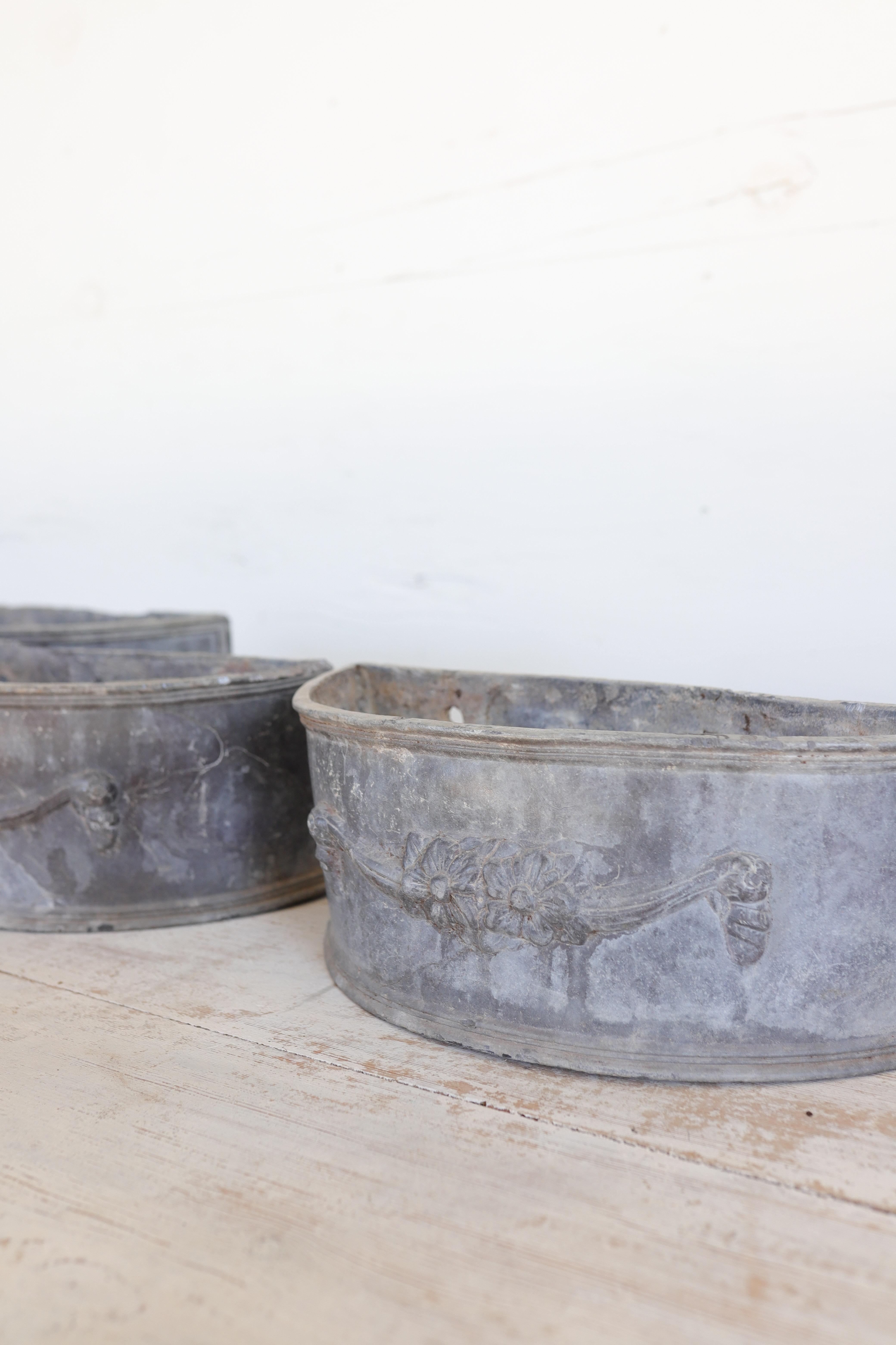 Antique Lead Demilune Planters with Swag Decoration In Fair Condition For Sale In Atlanta, GA