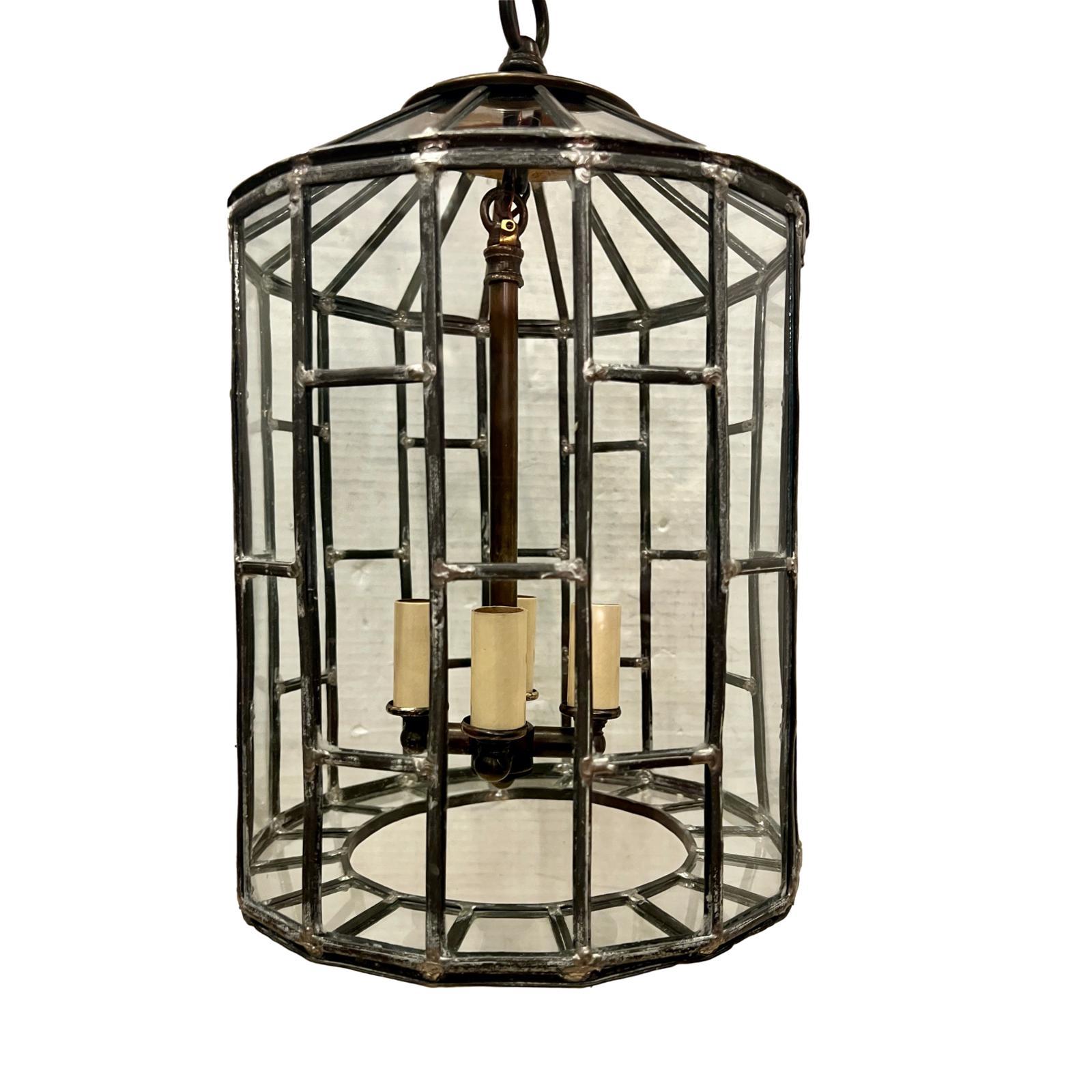 A circa 1920's French leaded glass lantern with four interior lights.

Measurements:
Current drop: 20