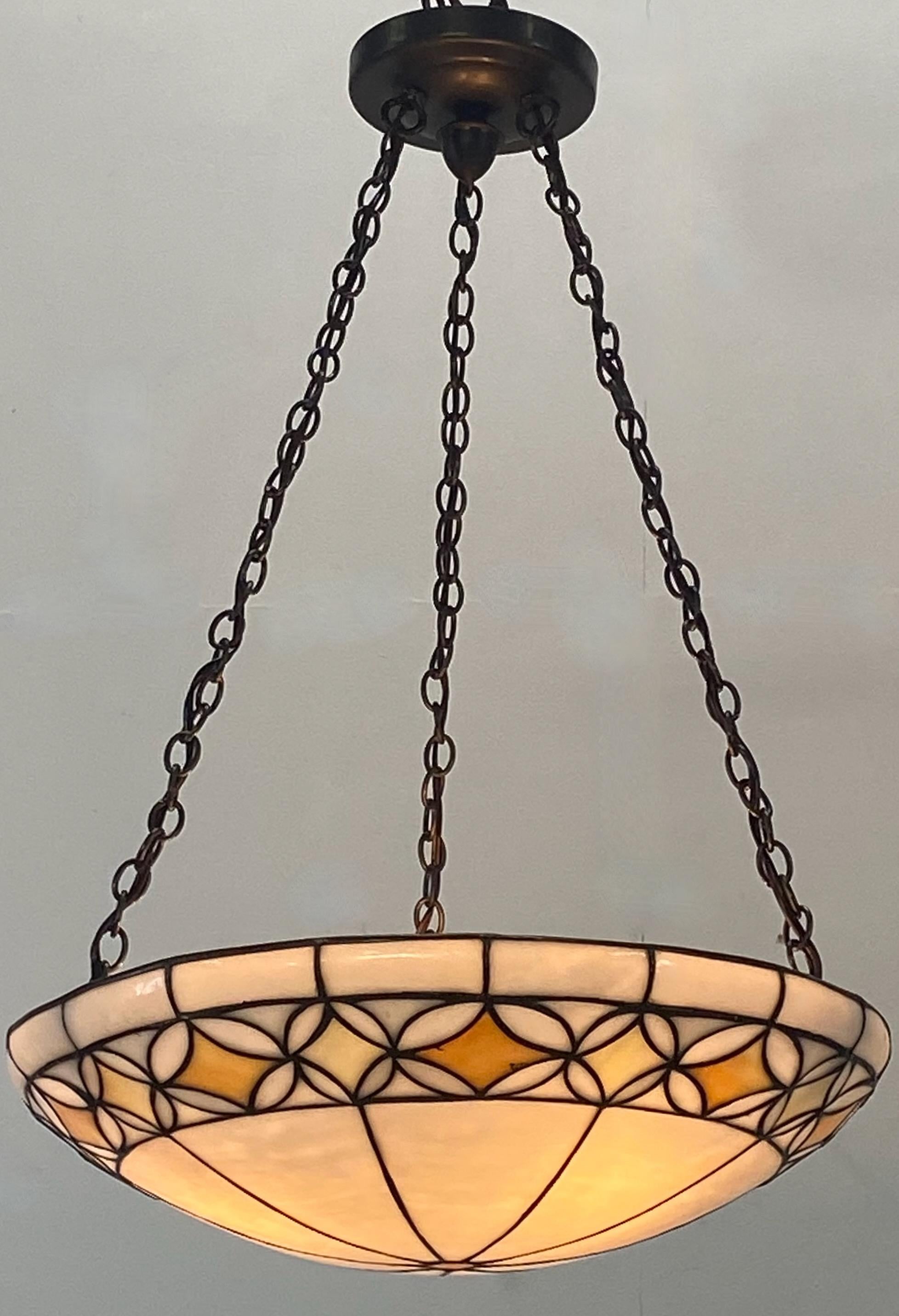 Antique Arts & Crafts style leaded glass hanging pendant light fixture.
Recently re-wired with new light sockets, holds candelabra size bulbs, ready to install.
In excellent condition.
American, early 20th century, 1905-1920.
 
