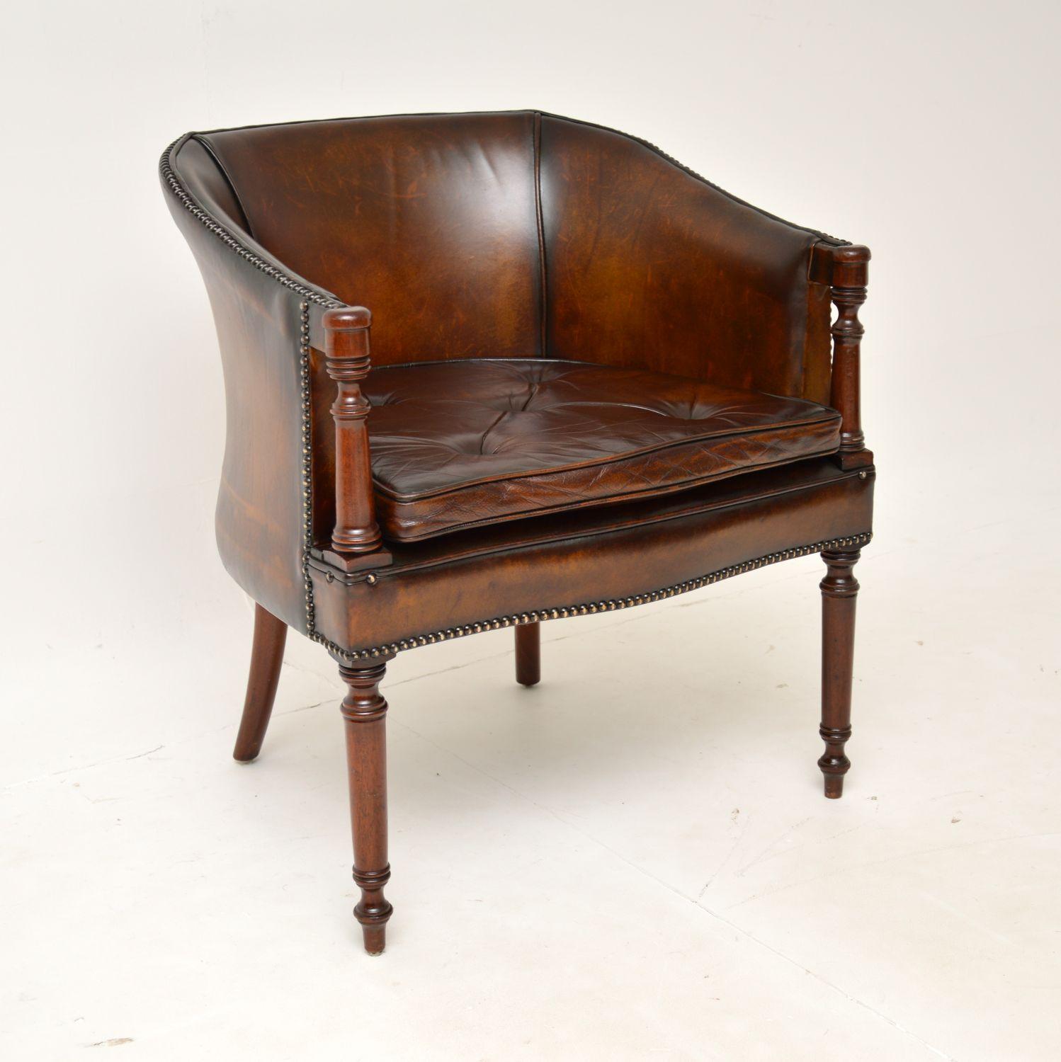 An excellent antique leather tub armchair in the Georgian style. This was made in England, it dates from around the 1950’s.

The quality is fantastic, this is a great size and is very comfortable. It is perfect for use as a desk chair or and