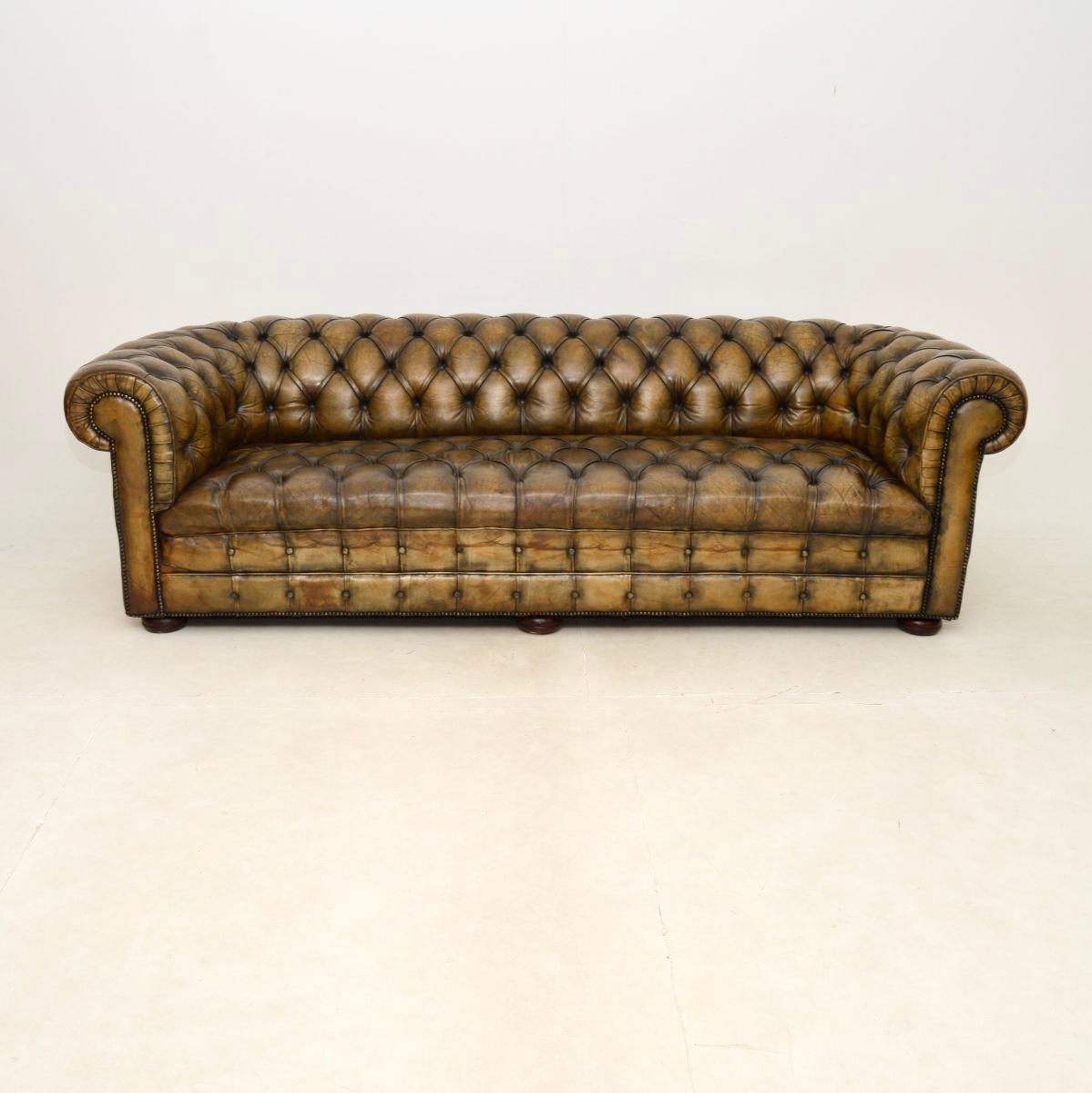 A large and very impressive antique leather Chesterfield sofa. This was made in England & we would date it to around the 1880-1890’s period.

The quality is outstanding, this is extremely well made and comfortable. The deep buttoned leather has a