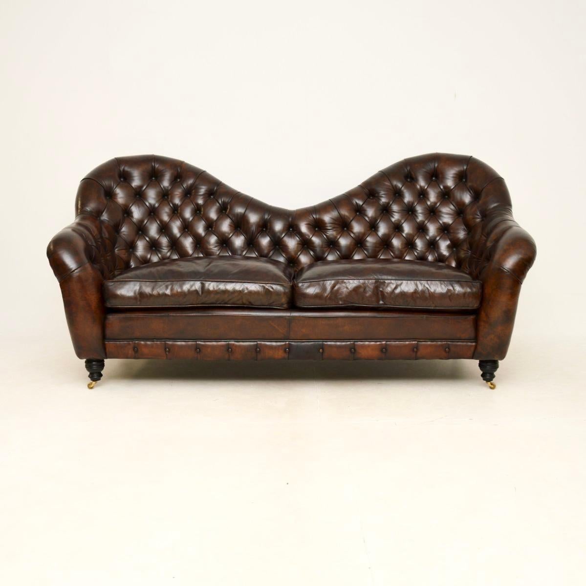 A stunning and extremely well made antique leather Chesterfield style sofa. This was made in England, it dates from around the late 20th century.

This is of super quality and is of very generous proportions. It has a beautiful and impressive