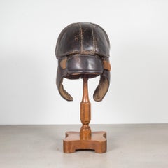 Antique Leather Football Helmet and Stand, c.1900