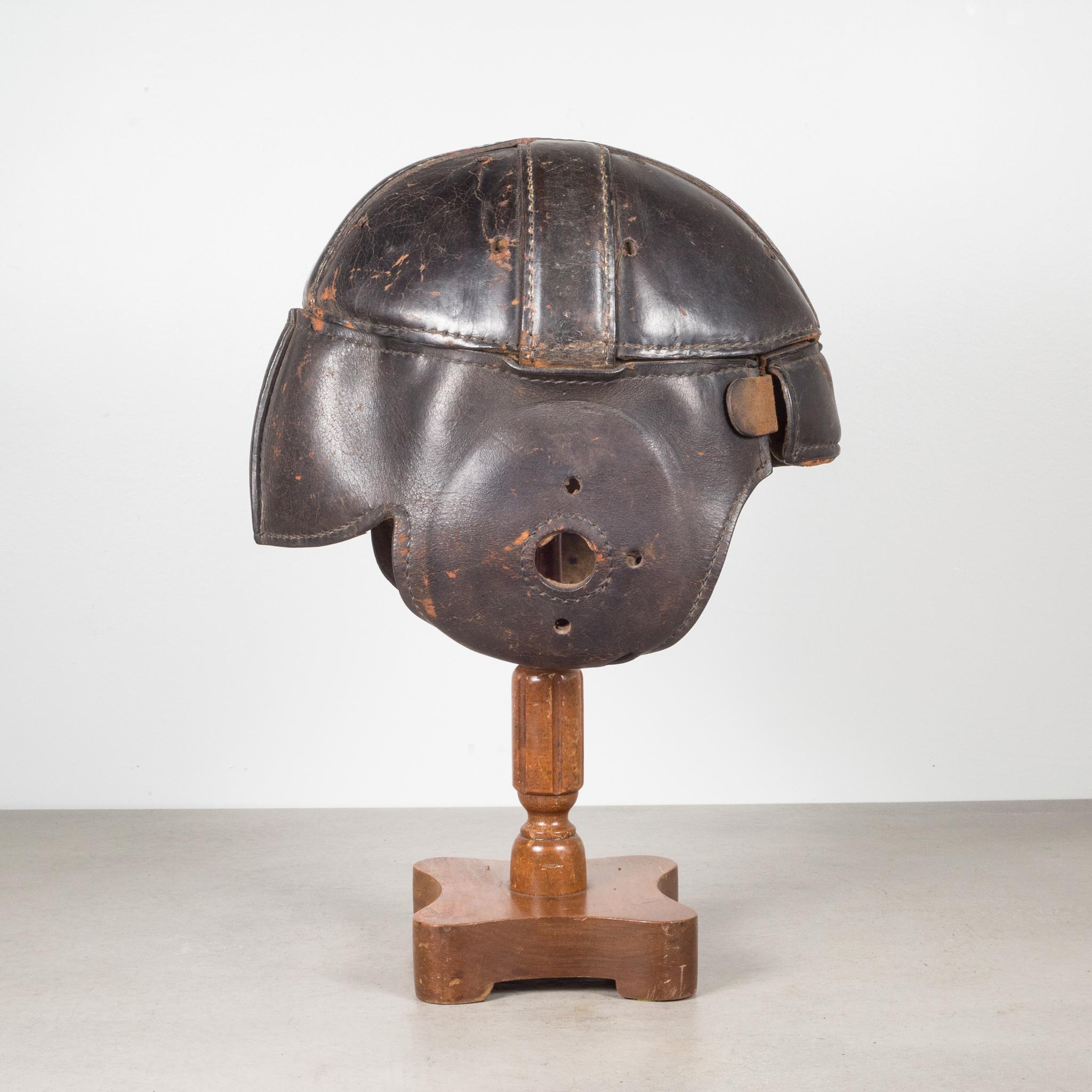Industrial Antique Leather Football Helmet and Stand, c.1900