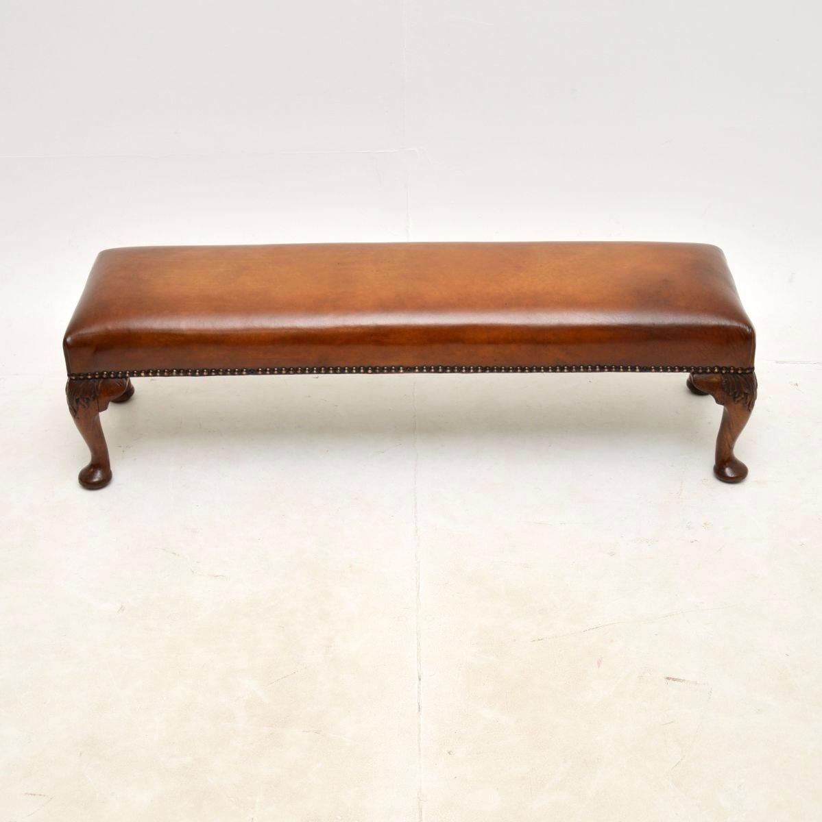 A charming antique foot stool. This was made in England, it dates from around the 1920’s.

It is of fantastic quality and is a useful size. It sits on solid cabriole legs with carving at the knees. We have had this newly upholstered in leather that