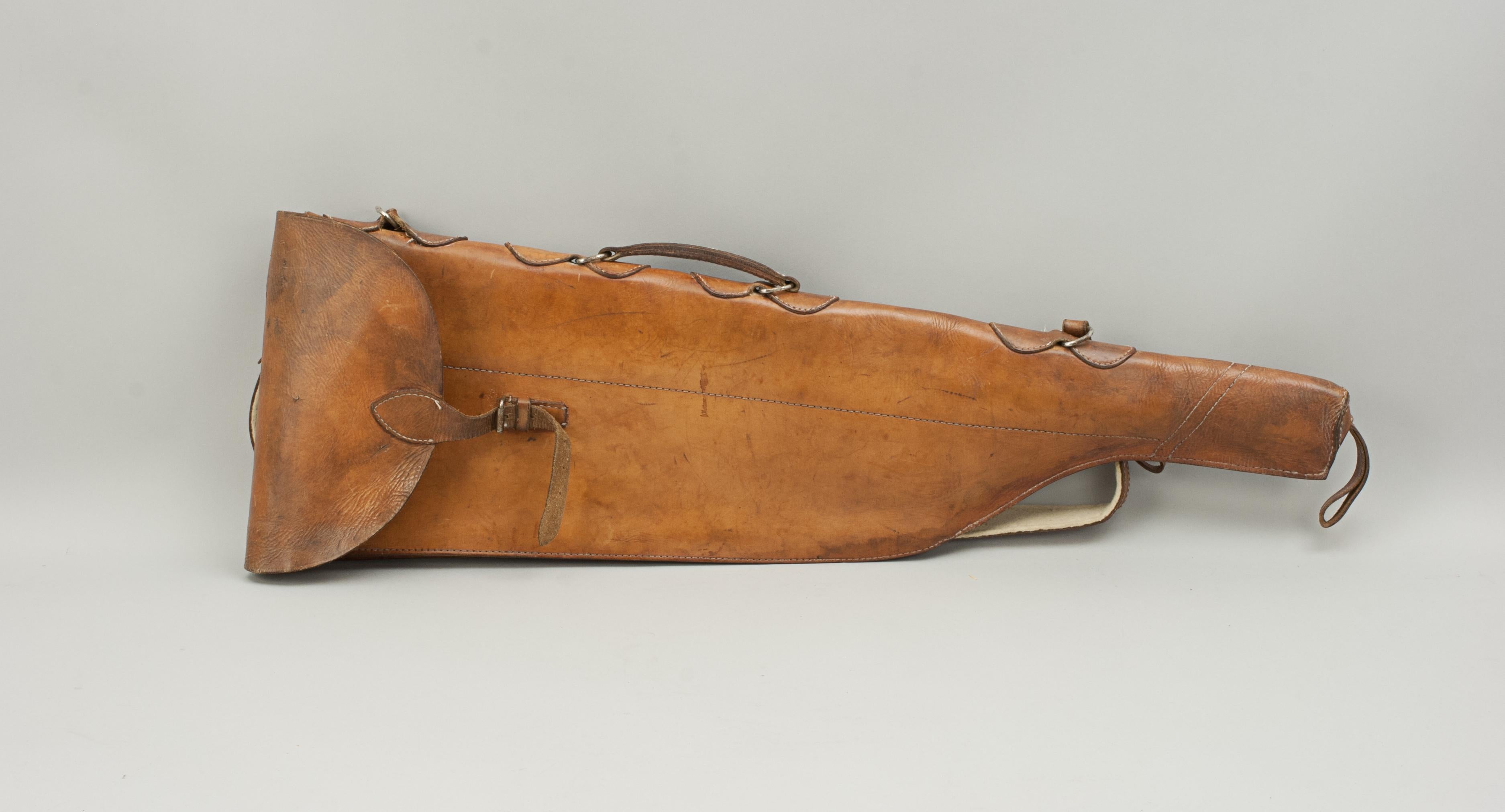 Antique leather gun case.
A fine tan leather leg of mutton gun case in original condition. This case is unusual, being soft rather than the usual hard gun case and the leather with a good clean patina. It is in good condition with a strong carry