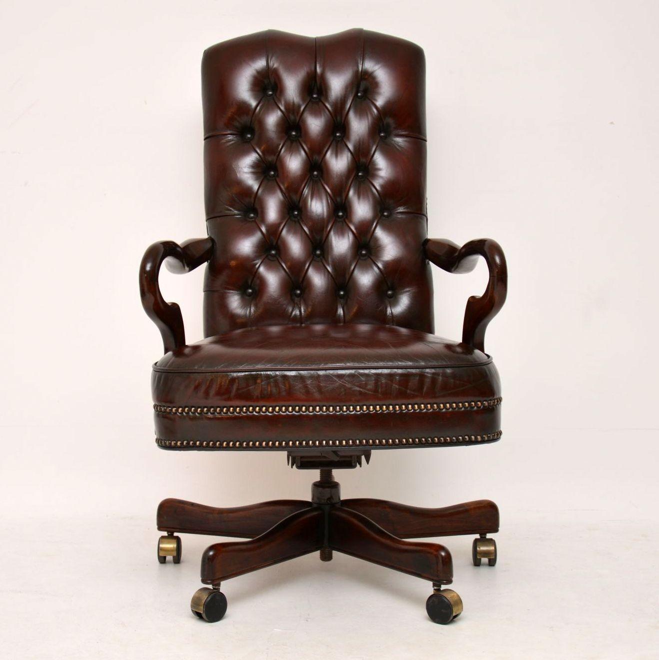 Antique Georgian style deep buttoned swivel desk chair which also tilts back. The leather has just been revived & polished by our leather specialist & is in good condition with plenty of character. This chair has a high back & a sprung seat, so is