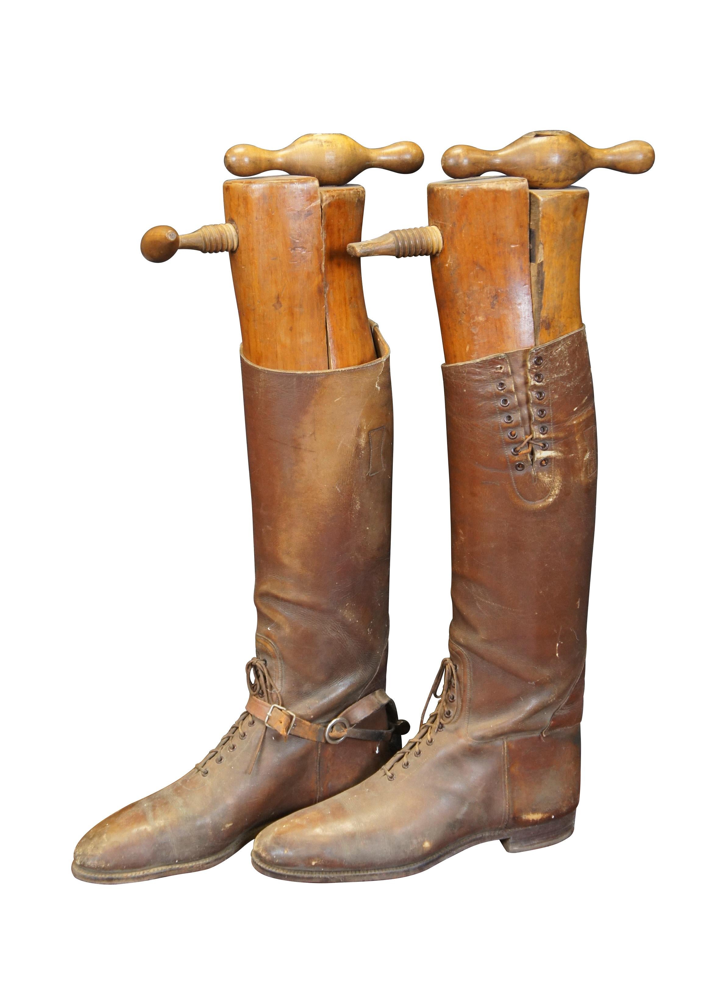 Circa early 20th century / World War I brown leather military riding / cavalry / military / sport boots. Pull on style with laces at the ankle and calf. On leather strap for spurs extant. Includes two part hardwood boot forms /