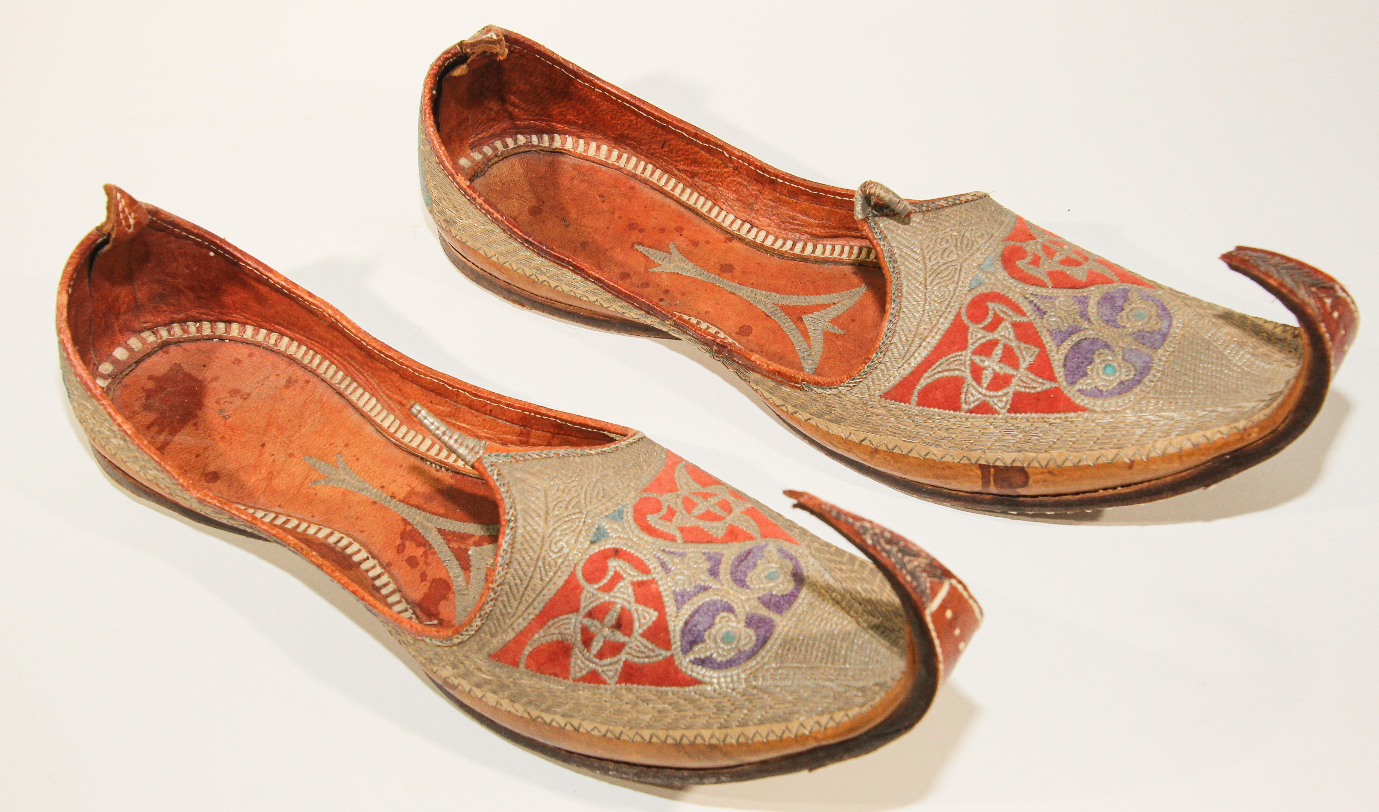 A pair of rare late 19th century hand stitched and hand tooled leather shoes with hand embroidered with gilt metallic threads.
Amazing antique Mughal gold embroidered traditional Islamic Indian leather shoes fit for a Maharaja. 
Arabic Persian