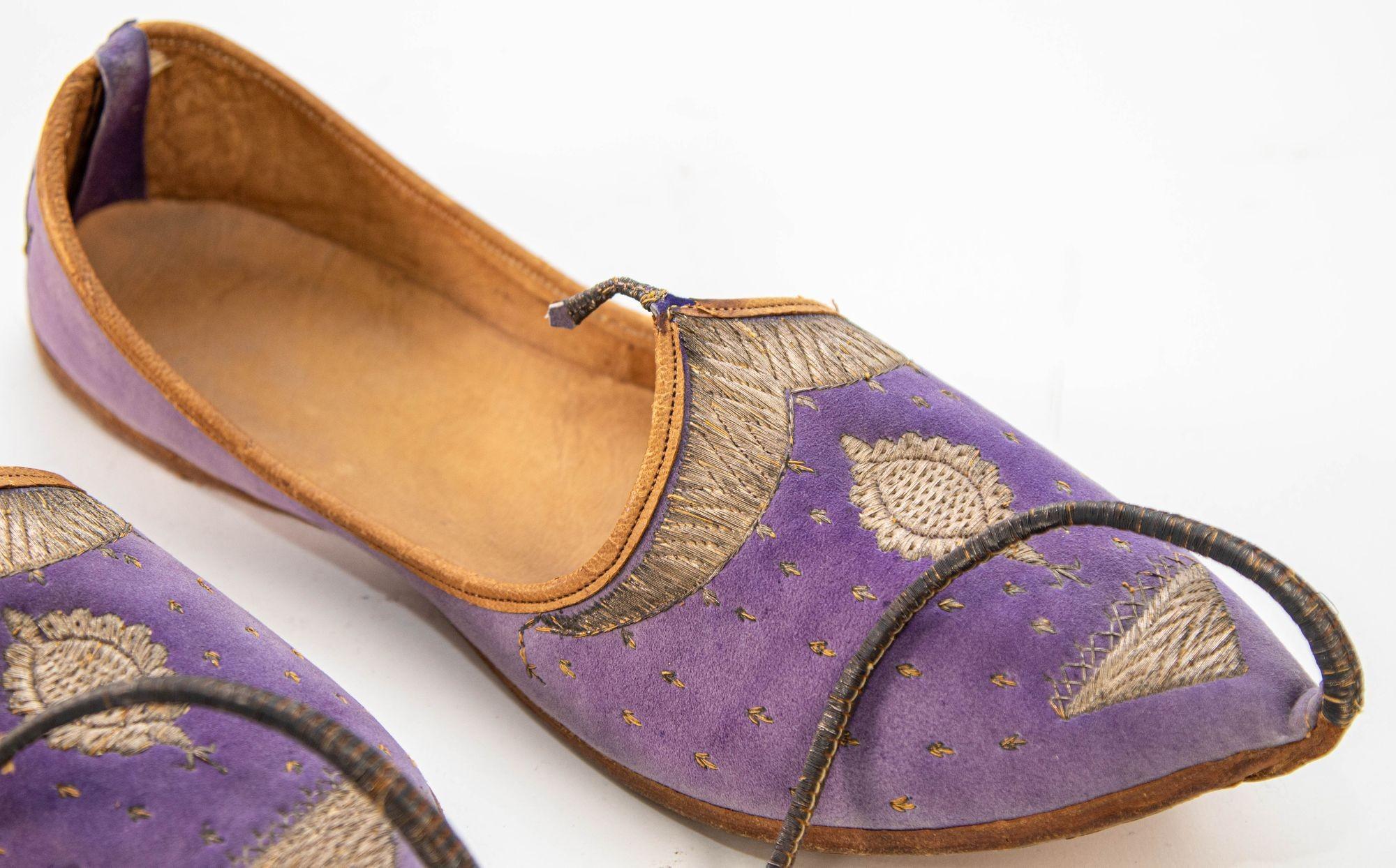 Antique Leather and purple velvet suede Mughal Moorish Turkish Shoes with Gold Embroidered.
A pair of rare late 19th century early 20th hand stitched and hand tooled leather shoes with hand embroidered with gilt metallic threads.
Measures: 11