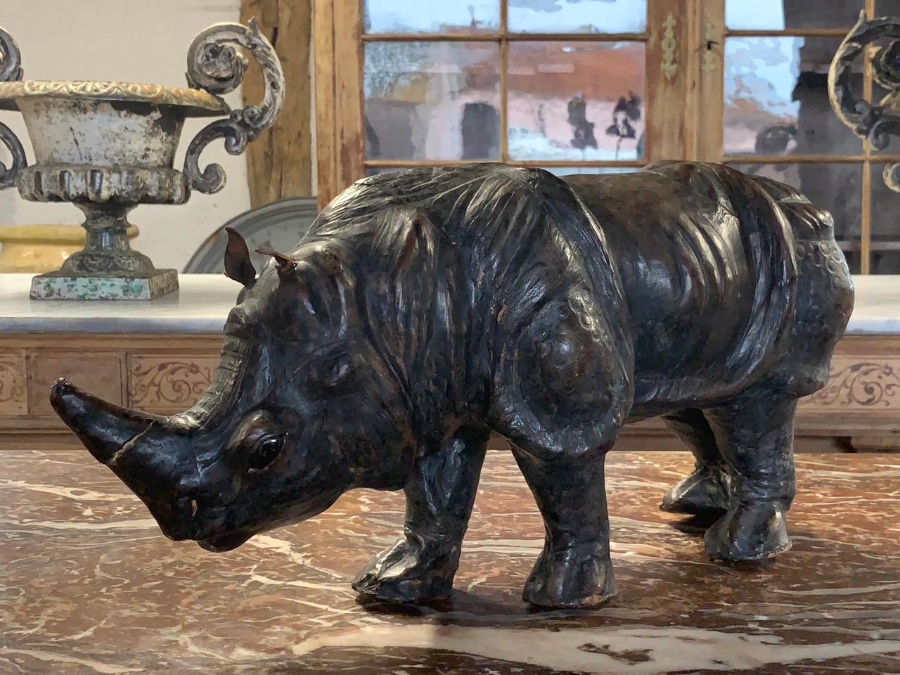 A lovely quality early 20th century leather Rhino with glass eyes. Wear in places from age and use. Circa 1900.