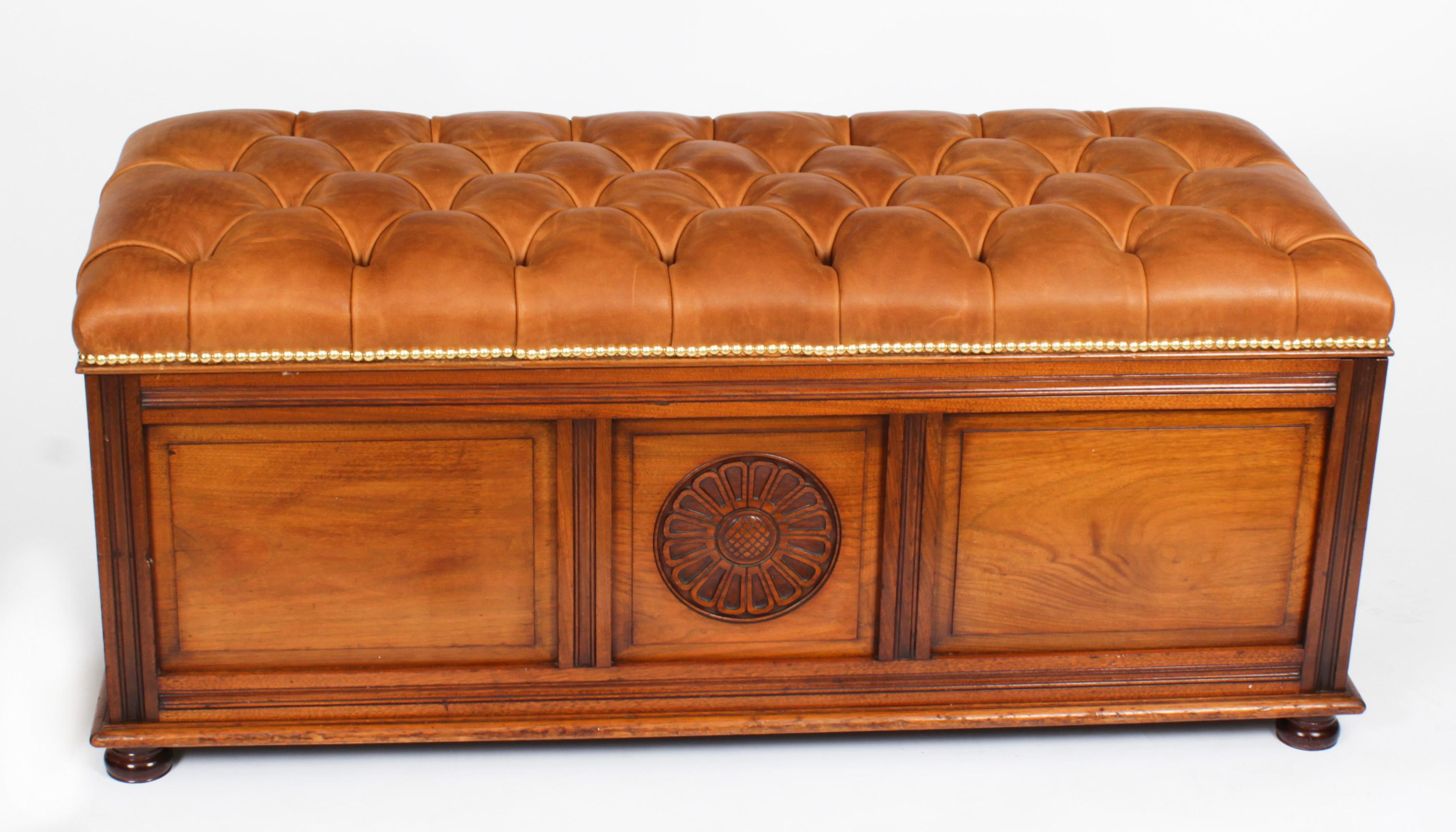 A late 19th century walnut ottoman, the upholstered lifting lid over a decorative three paneled base, and raised on bun feet, circa 1880 in date.
The ottoman / window seat / hall seat with a striking top that has been reupholstered with a sumptuous