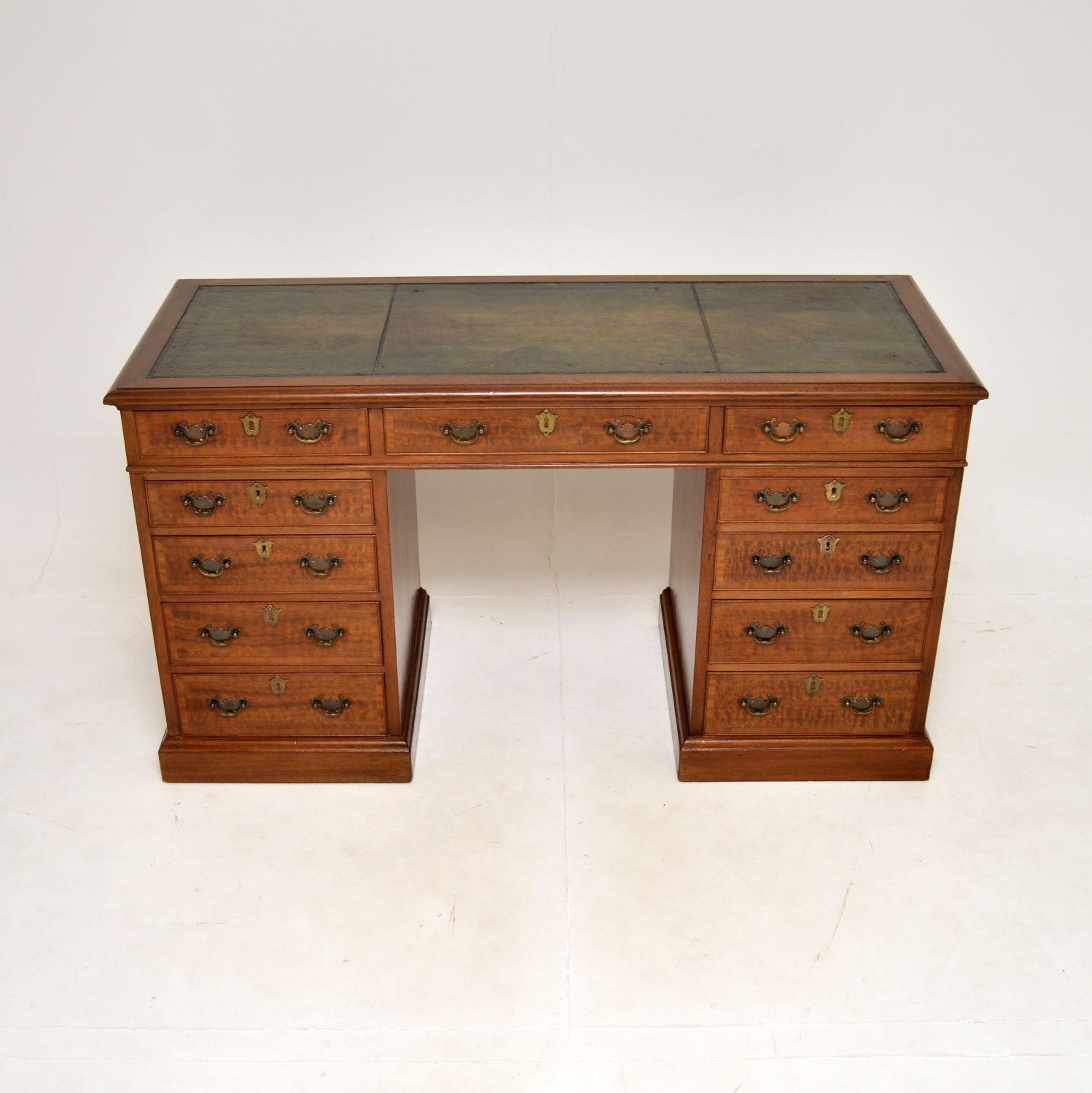 A smart and very well made antique leather top pedestal desk. This was made in England, it dates from around the 1930-50’s.

It is of outstanding quality and is a very useful size. It is quite wide and also slim from front to back, meaning it is not
