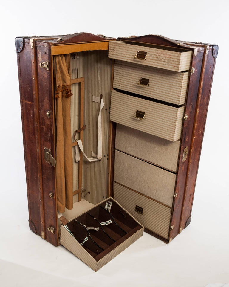 Sold at Auction: Antique Steamer Trunk Wardrobe/Cabin Wardrobe by Meyering,  Chicago - fully lined interior with 5 assorted drawers with internal  storage compartments and lift out trays, steel drop handles with chrome