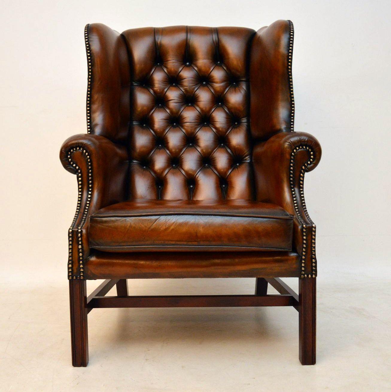 Large antique Chippendale style leather wing armchair in good original condition & very comfortable too. The leather is naturally distressed & has lots of character. It has a deep buttoned back, generous wings, hand tacking & a loose cushion. The