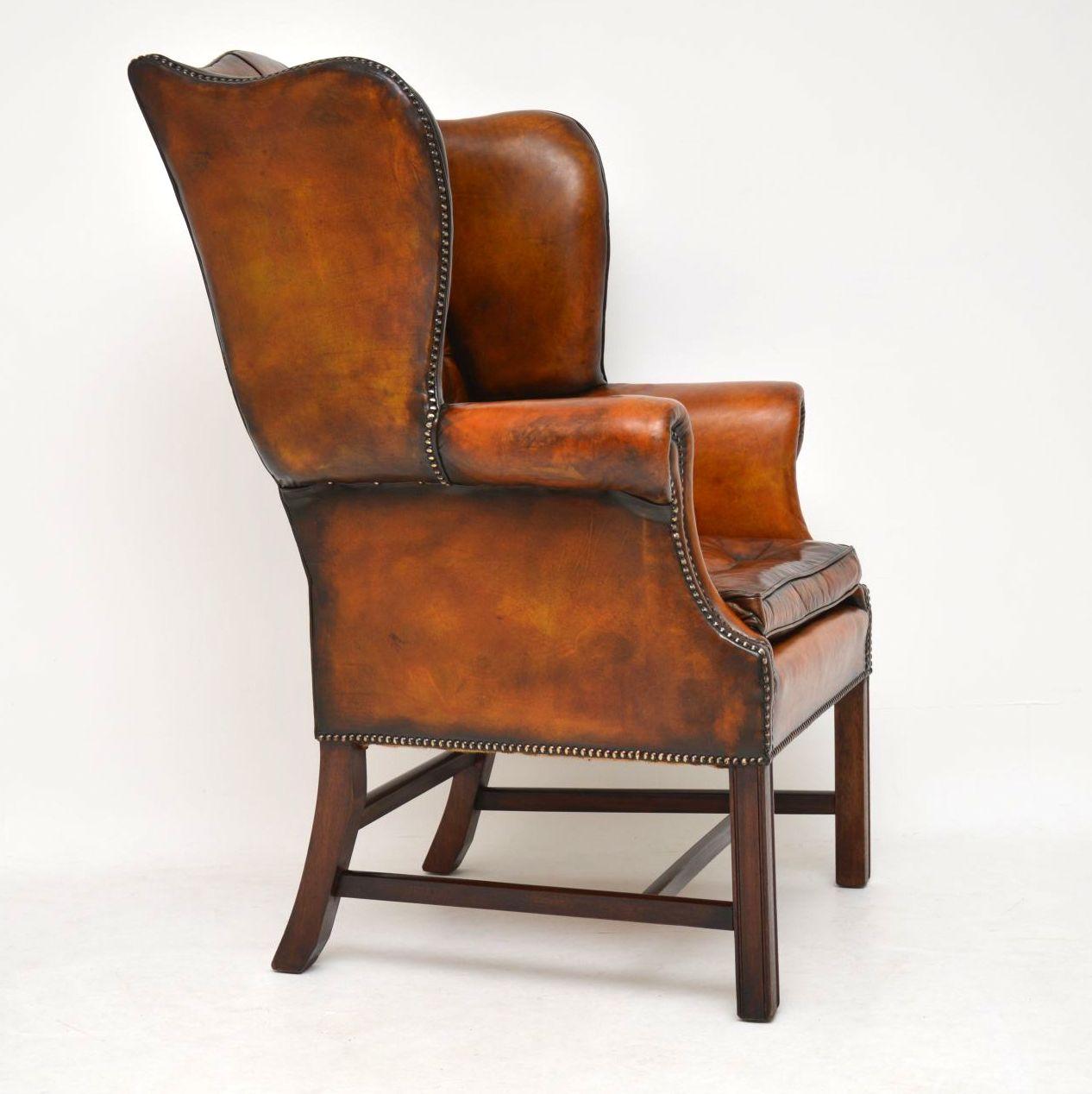 This antique deep buttoned leather wingback armchair has a wonderful shape and original color. It’s in excellent condition and has aged beautifully. Our leather specialist has just revived and polished the leather, so bringing out all the various
