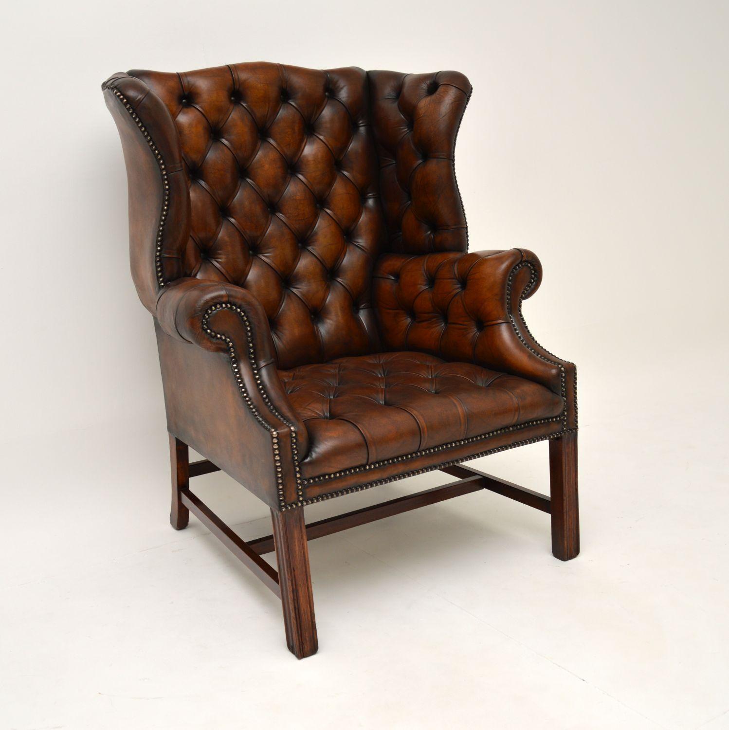 A fantastic antique deep buttoned leather wing back armchair in the Chippendale style & dating from around the 1920-30’s period.
The quality is amazing, this is very well made, sturdy and is of generous proportions. It’s also very comfortable as