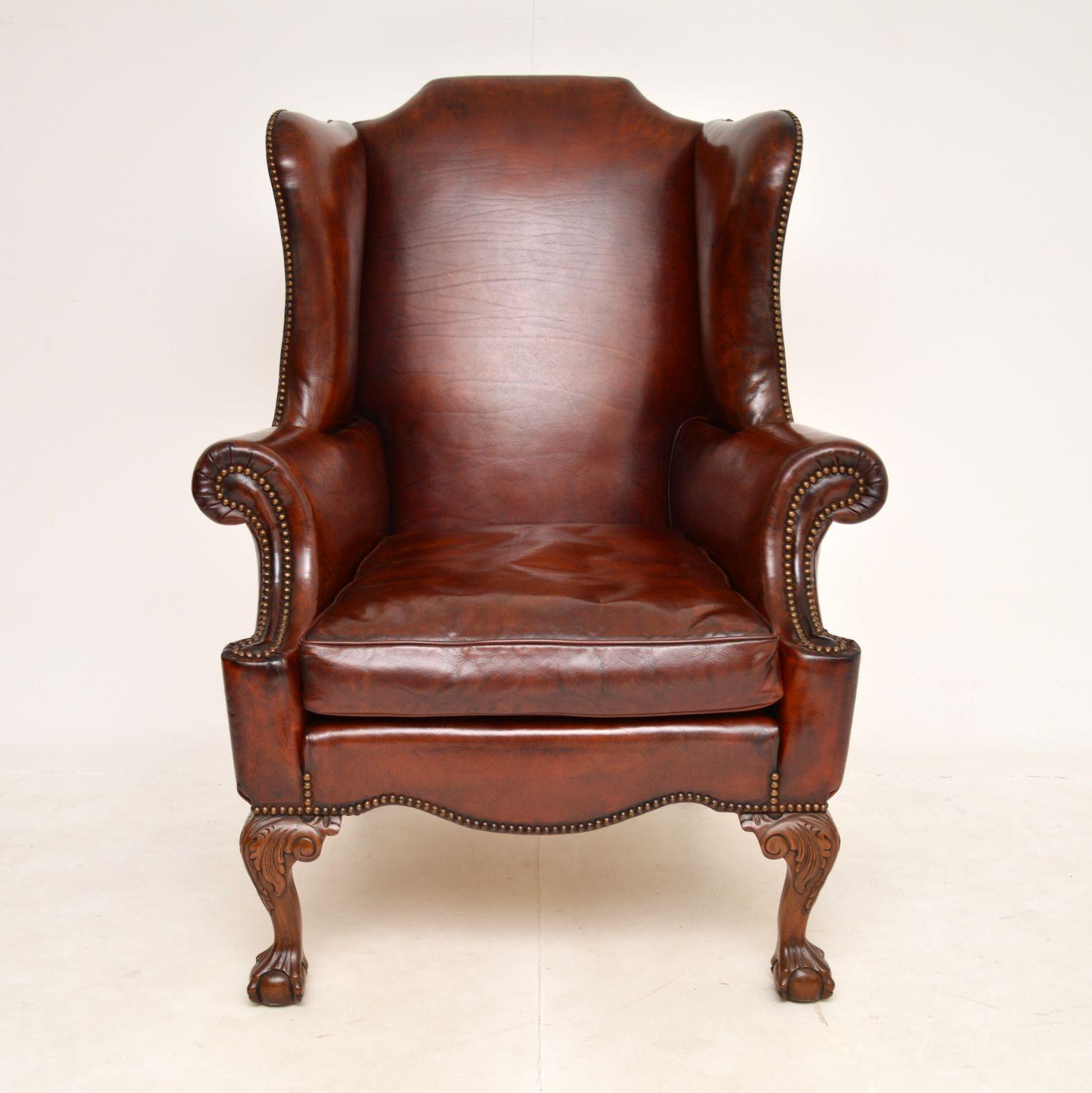 An absolutely beautiful and very comfortable antique leather wing back armchair. This was made in England, it dates from around the 1930’s.

This armchair is superb quality with brass studded soft leather upholstery and the cushion is down filled.