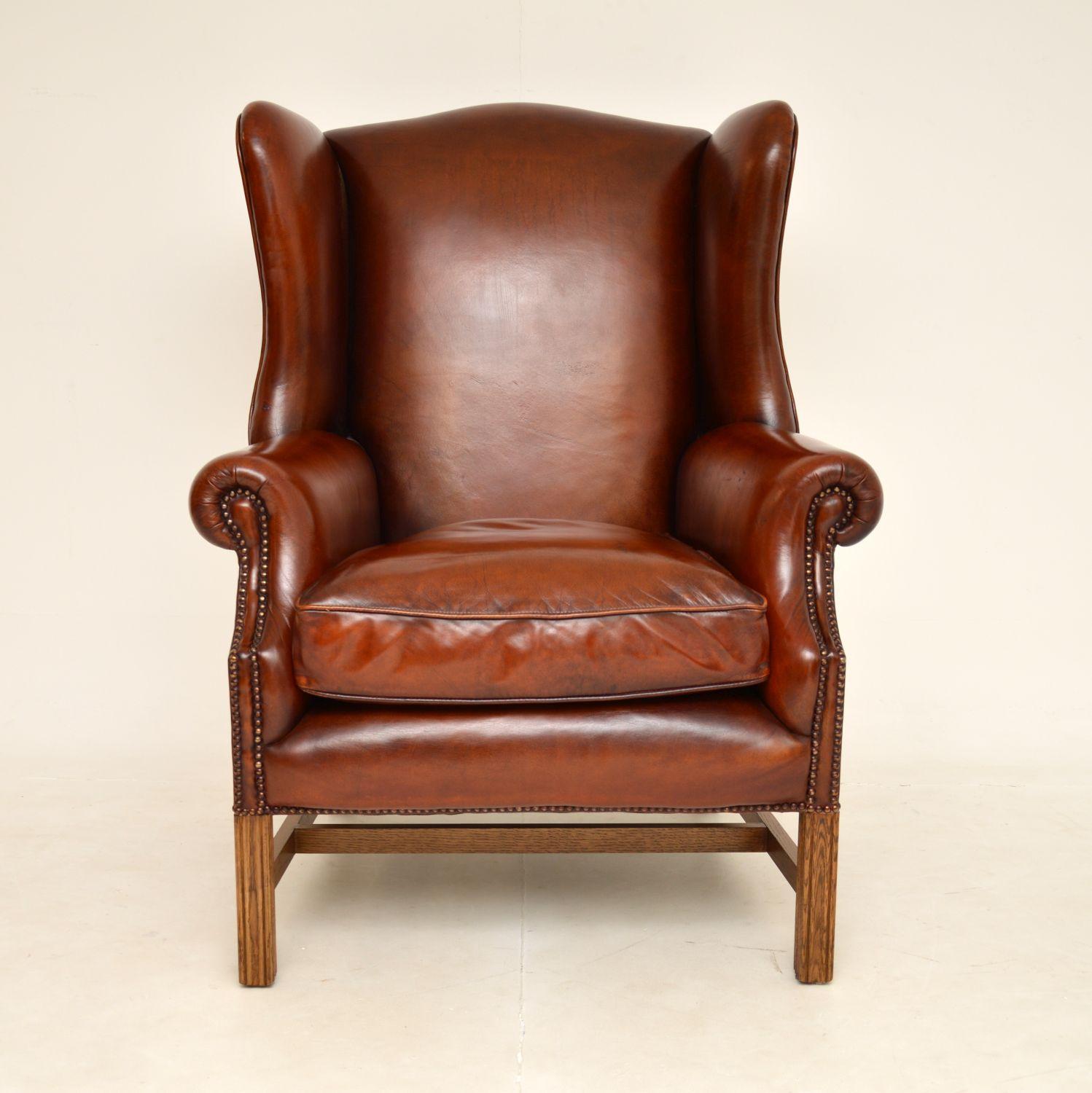 A very large and extremely comfortable antique leather wing back armchair in the Georgian style. This was made in England, it dates from around the 1950’s.

This is of very generous proportions and is most impressive. The quality is outstanding, the