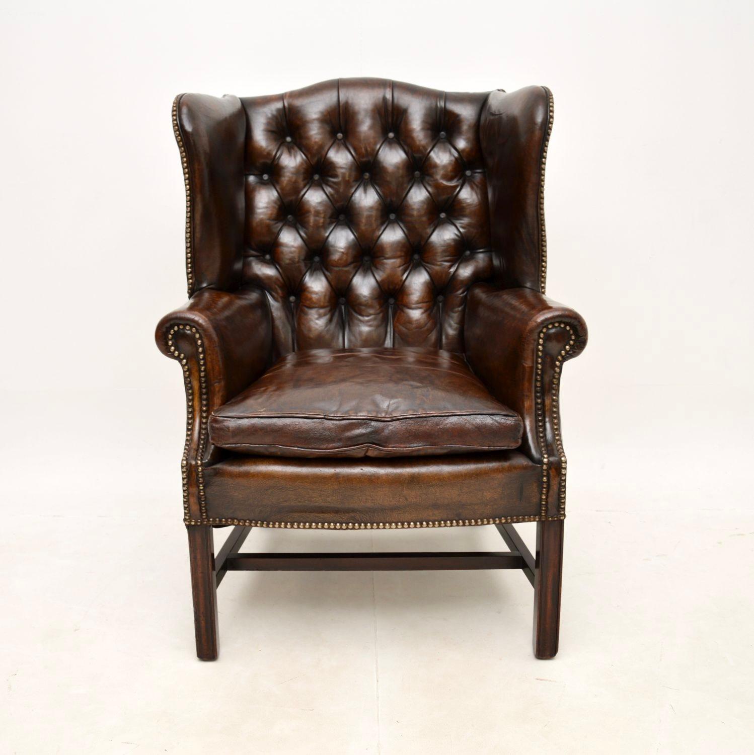 A fantastic antique leather wing back armchair. This was made in England, it dates from around the 1890-1910 period.

It is of superb quality with lovely proportions, it is very comfortable to relax in. The deep buttoned leather upholstery is all
