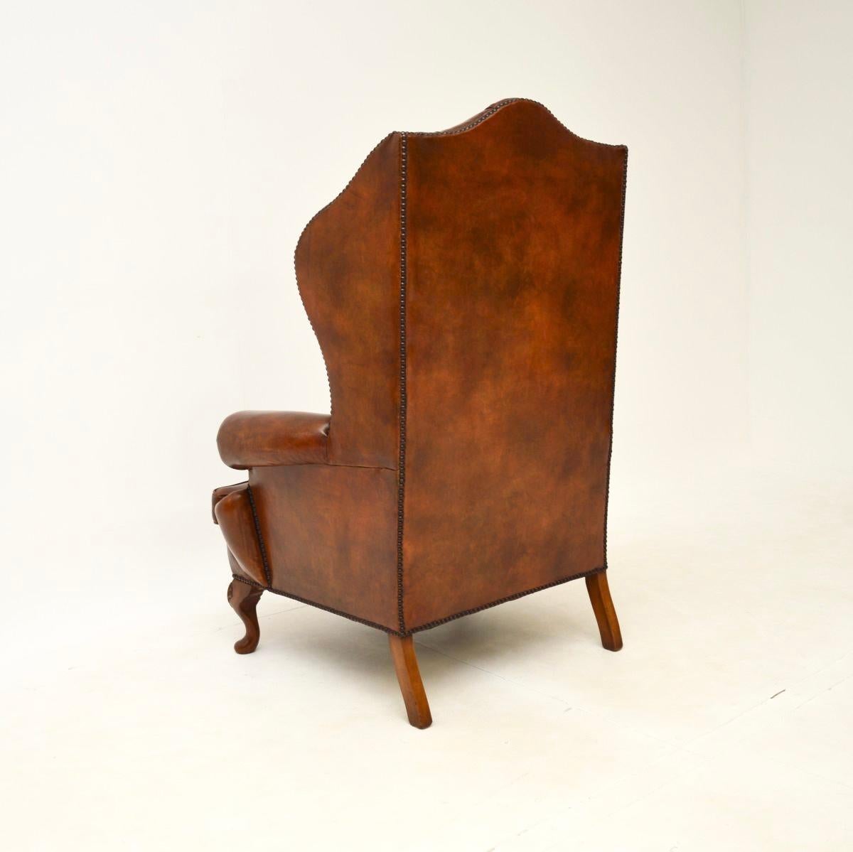 Mid-20th Century Antique Leather Wing Back Armchair For Sale