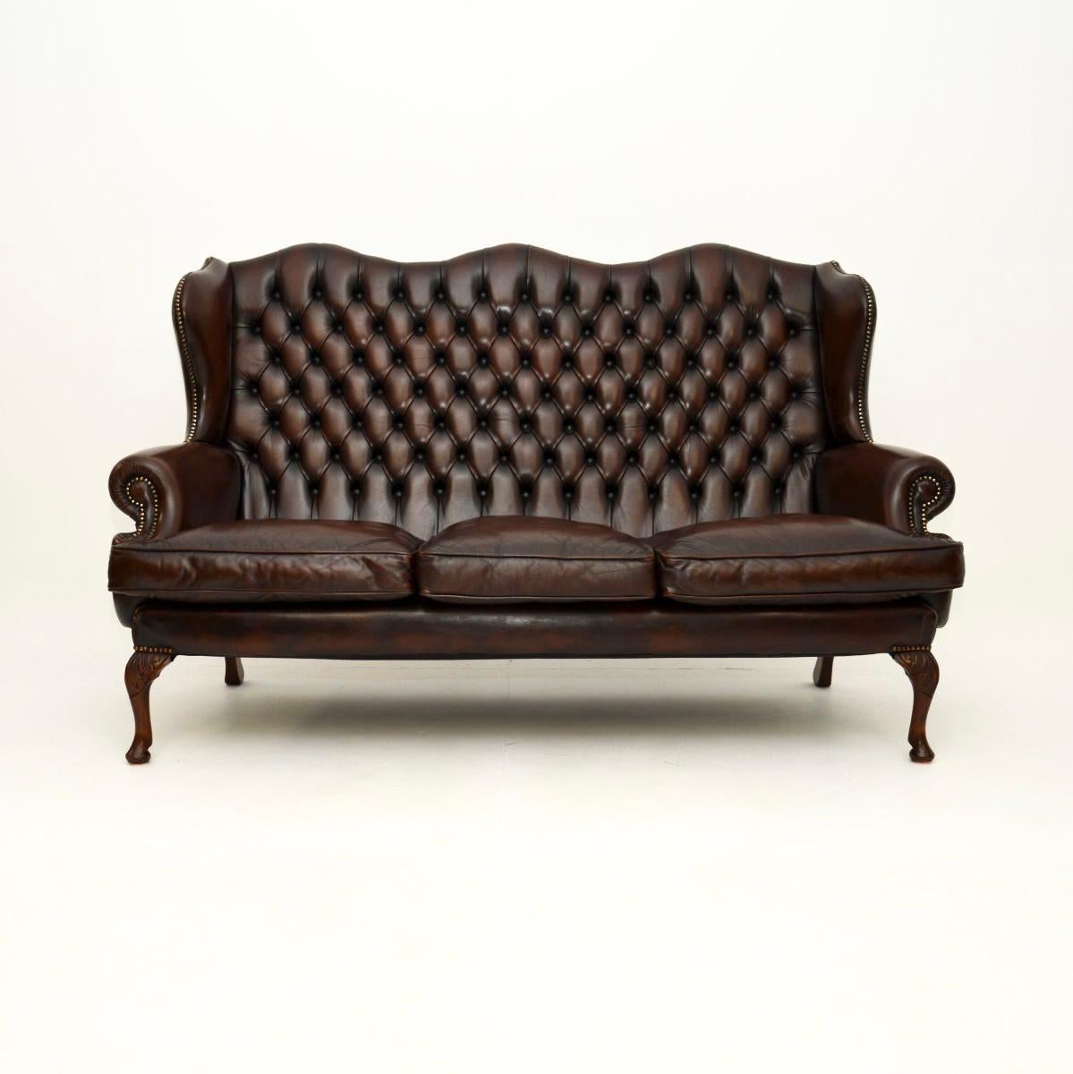 A superb antique leather wing back sofa. This was made in England, it dates from around the 1930’s.

The quality is superb and this is extremely comfortable to relax in. It is very supportive and has down filled cushions. The brown leather has a