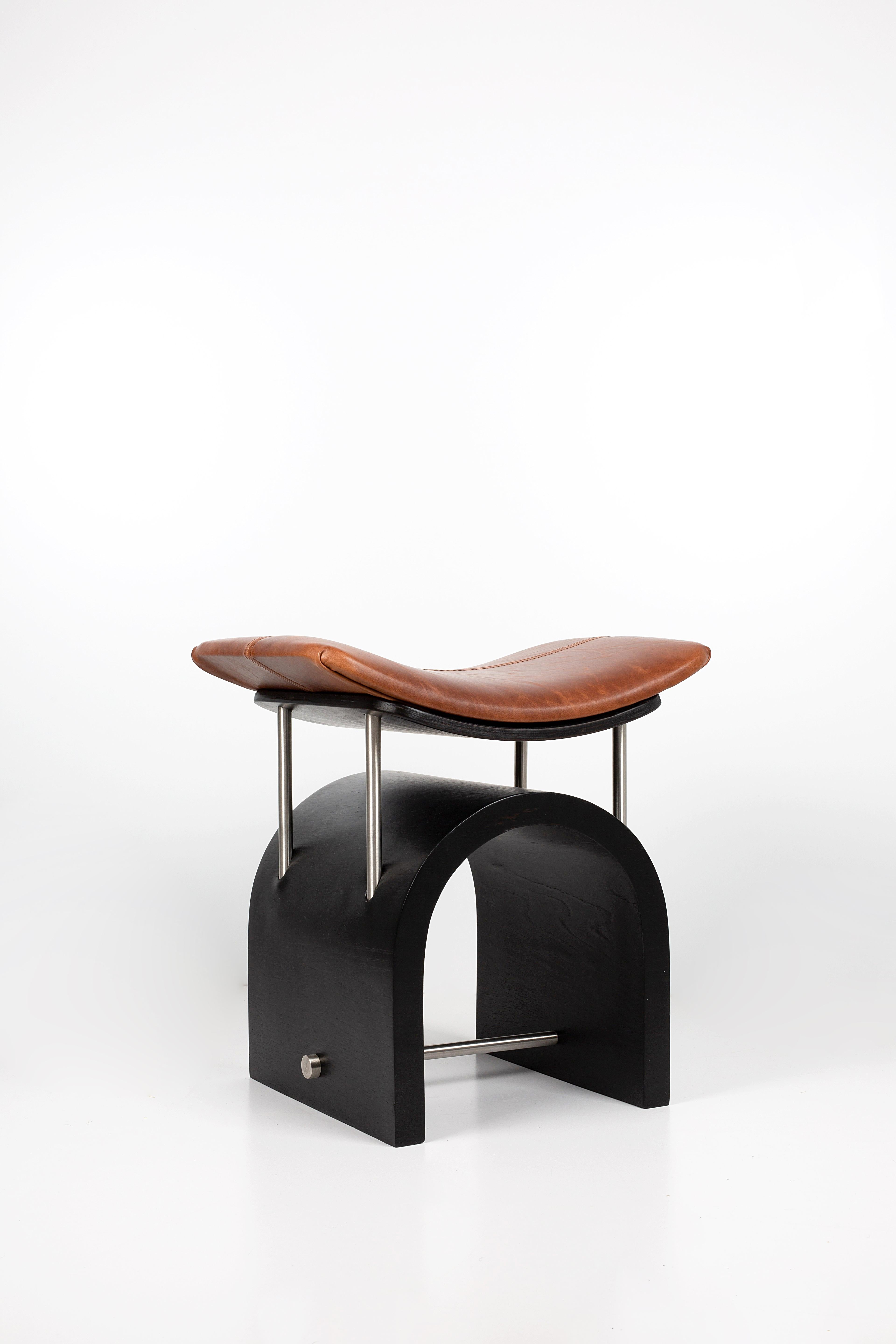 Black Leather Wing Stool by Studio Laf
Dimensions: L43 cm x W35 x H44 cm
Materials: Plywood, Stainless Steel, Leather
Structure: Black Plywood
Available: different colours Leather: Brown, Black, Antique Brown, Cherry Red.


It emerged with