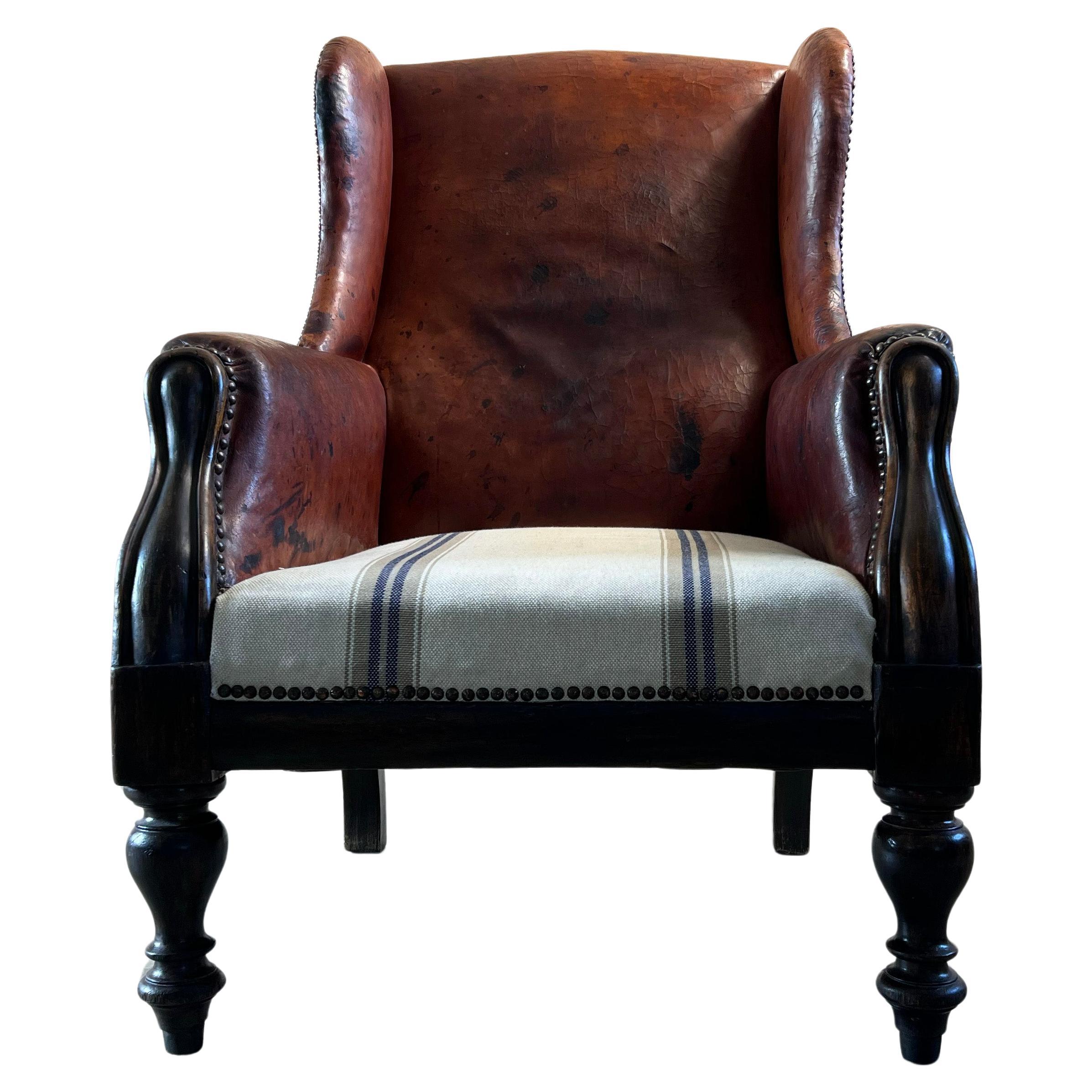 Antique Leather Wingback Arm Chair For Sale