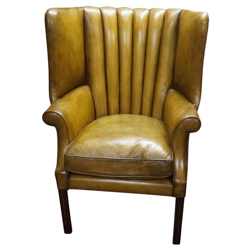 Antique leather wingback chair For Sale