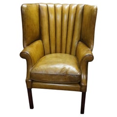 Antique leather wingback chair