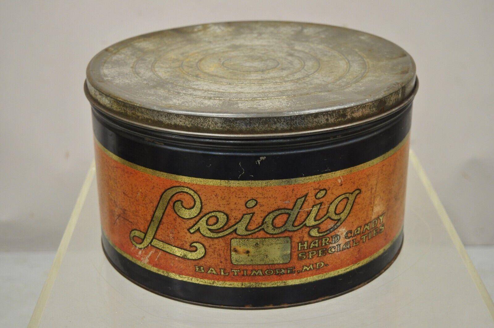 Antique Ledig hard candy tin metal round lidded advertising can. Circa early 20th century. Measurements: 7