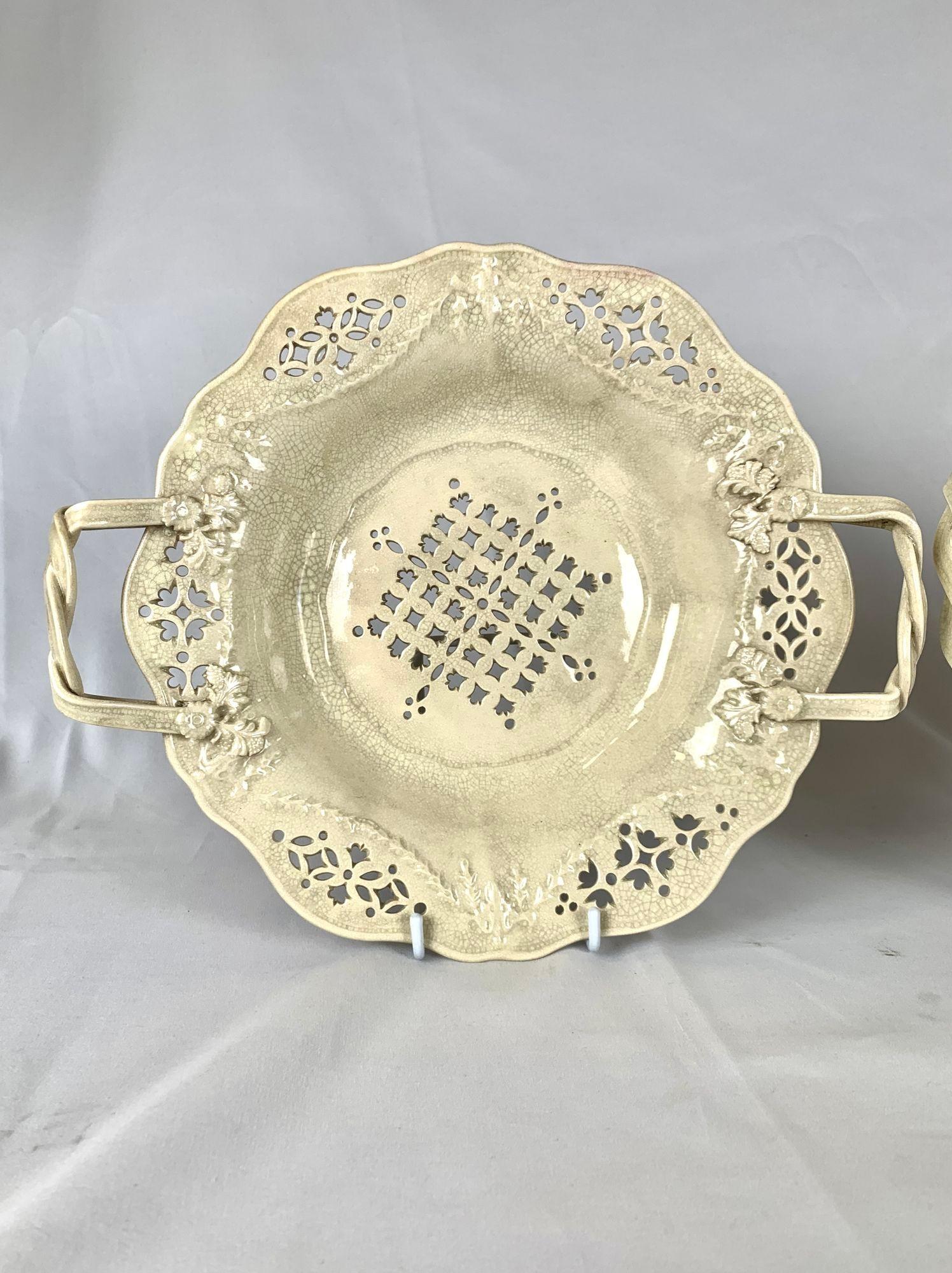 This pair of Late Leeds creamware berry strainers was made in West Yorkshire, England, circa 1870.
Originally used to wash and serve berries, they allowed excess liquid to drain away through the intricate pierced design.
Today, they can be displayed