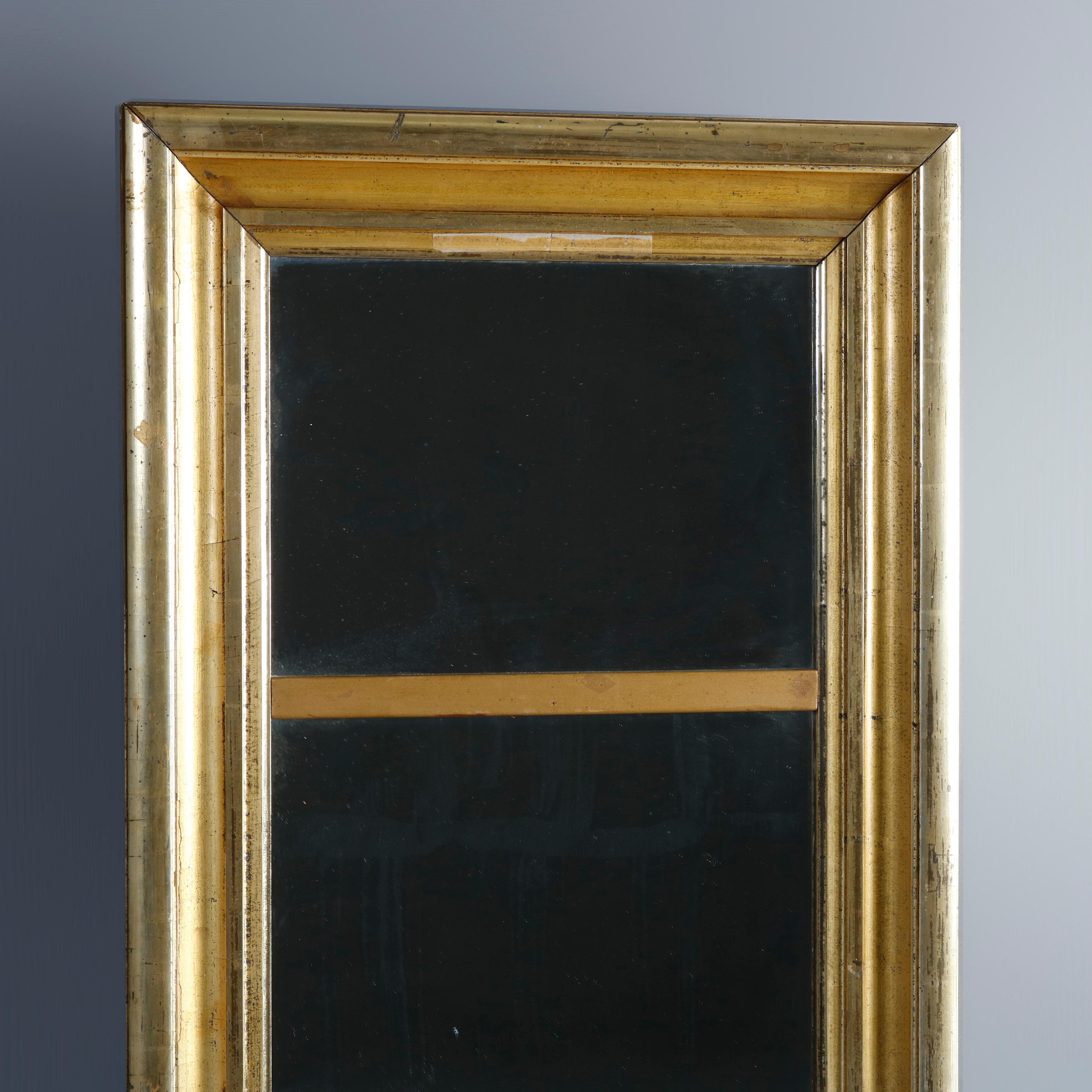 An antique Trumeau wall mirror offers lemon giltwood frame housing upper and lower mirror plates, circa 1840

Measures: 45