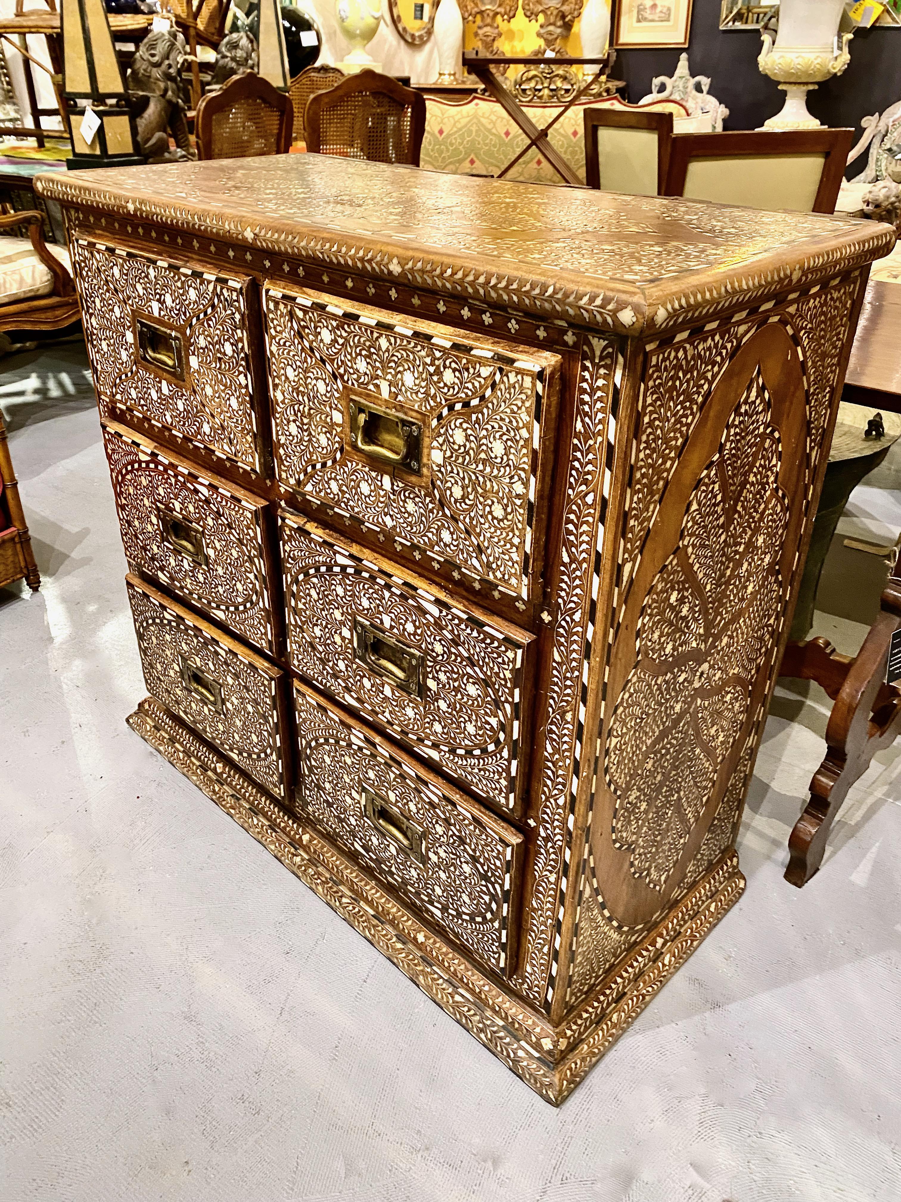This is a superb example of a Levantine Chest of Drawers. All exposed surfaces of the chest are finely detailed in inlaid bone, ebony and shell. The inlay takes the form of abstract flora in traditional Muslim patterns. All elements of the inlay