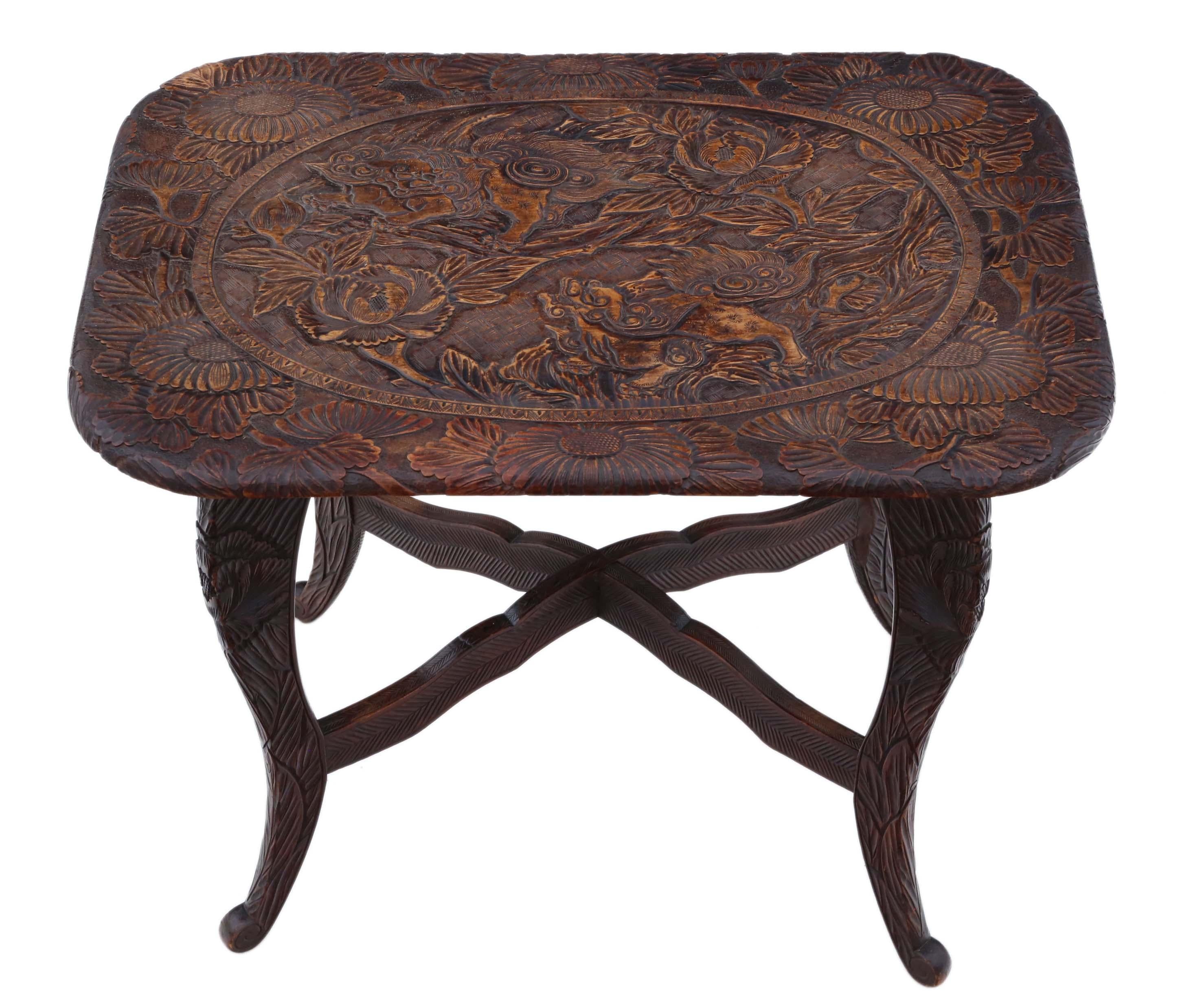 Antique fine quality carved Chinoiserie hardwood writing side or occasional table. Believed to have originally come from Liberty C1900. Decorated with Foo dogs, trees and plants.

No loose joints and no woodworm. Full of age, character and charm.